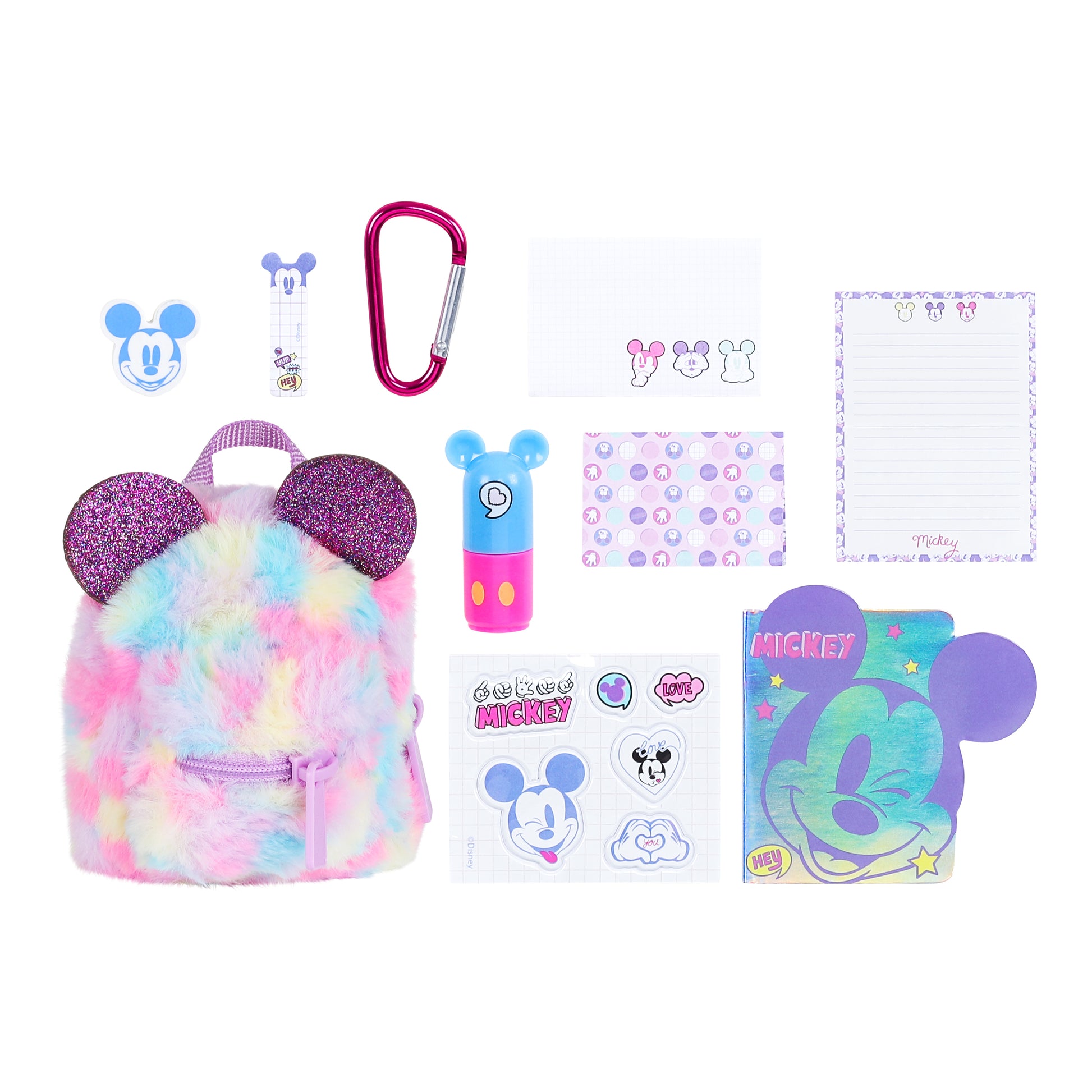 Collection of Disney-themed stationery items including a mini backpack, carabiner, and notebooks on a white background.
