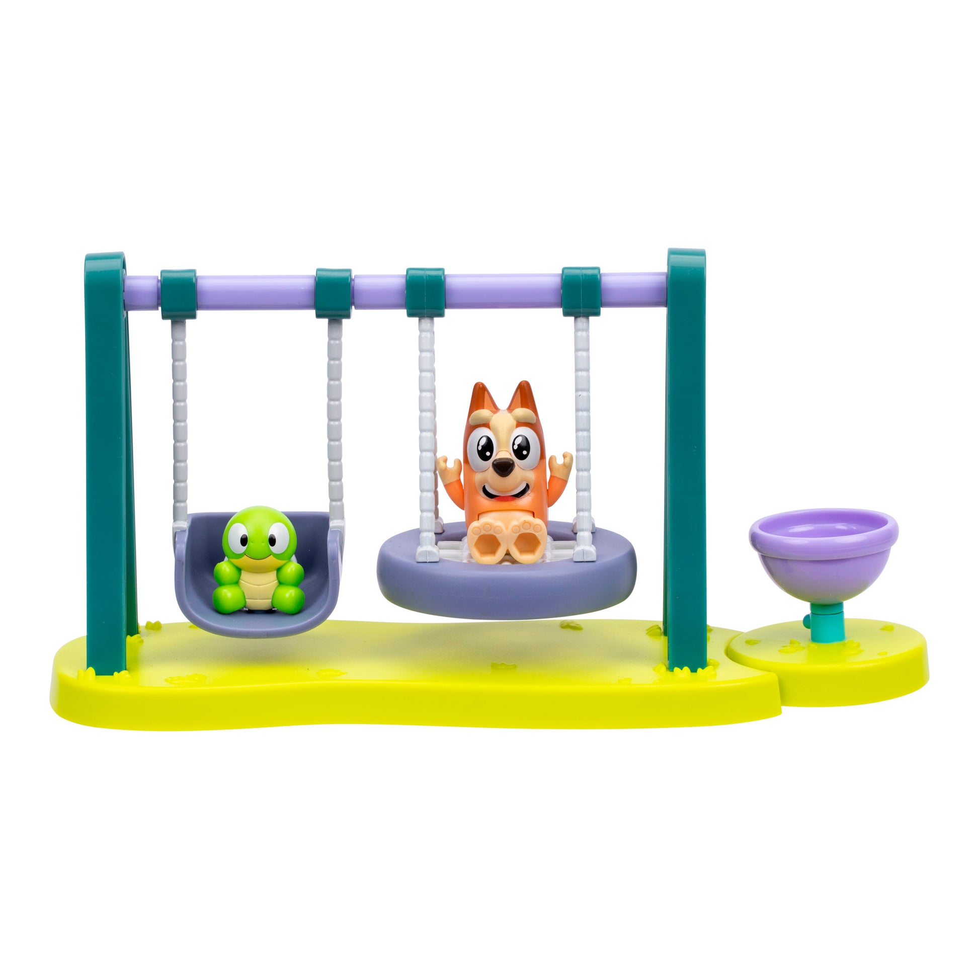 Toy figure of a dog and turtle on swings with a yellow base on a white background