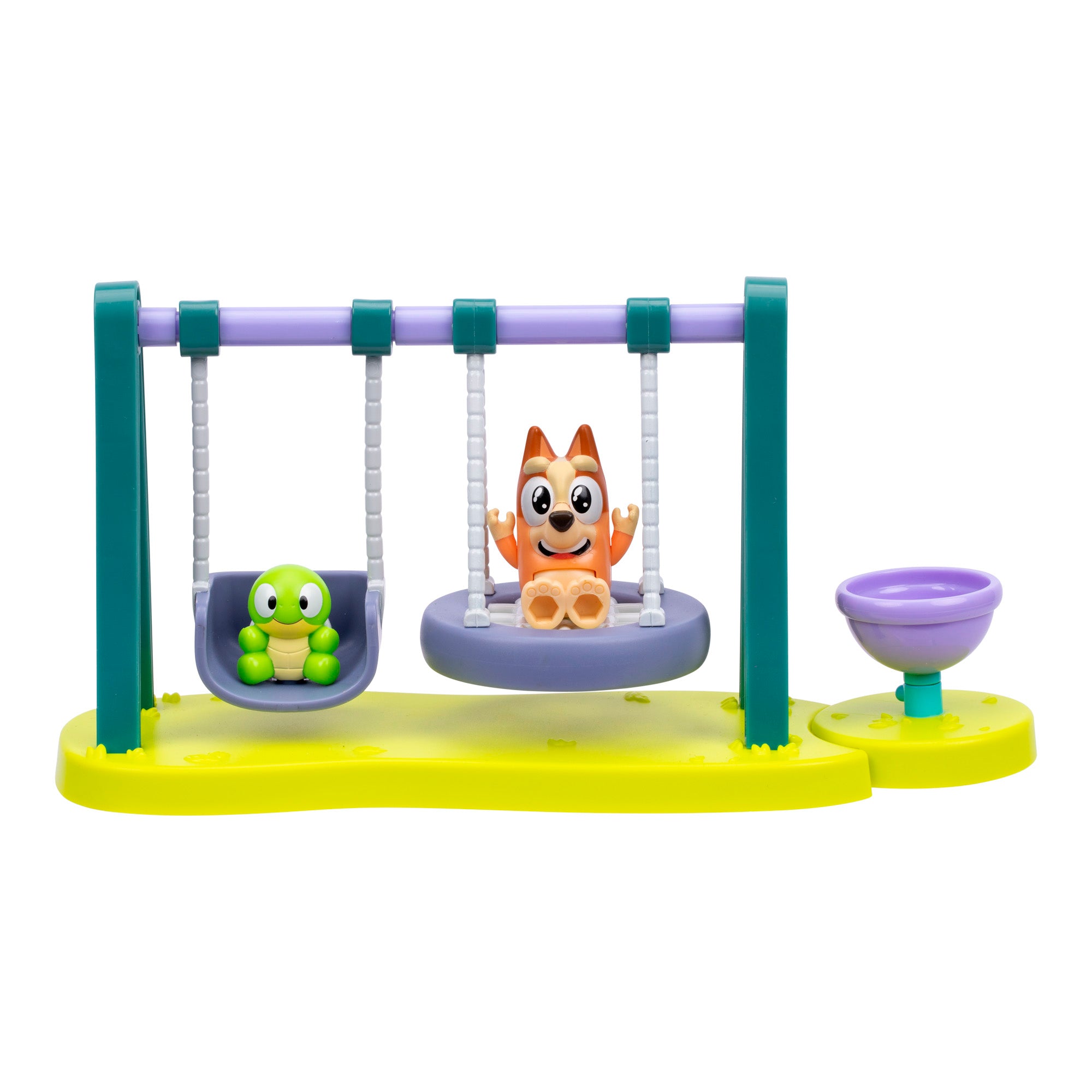 Toy figure of a dog and turtle on swings with a yellow base on a white background