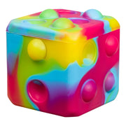 The Toysmith Poppin' Dice - Rainbow by Toysmith is a rainbow-patterned pop-it fidget toy shaped like a dice, featuring raised and indented bubbles on its sides for pressing.