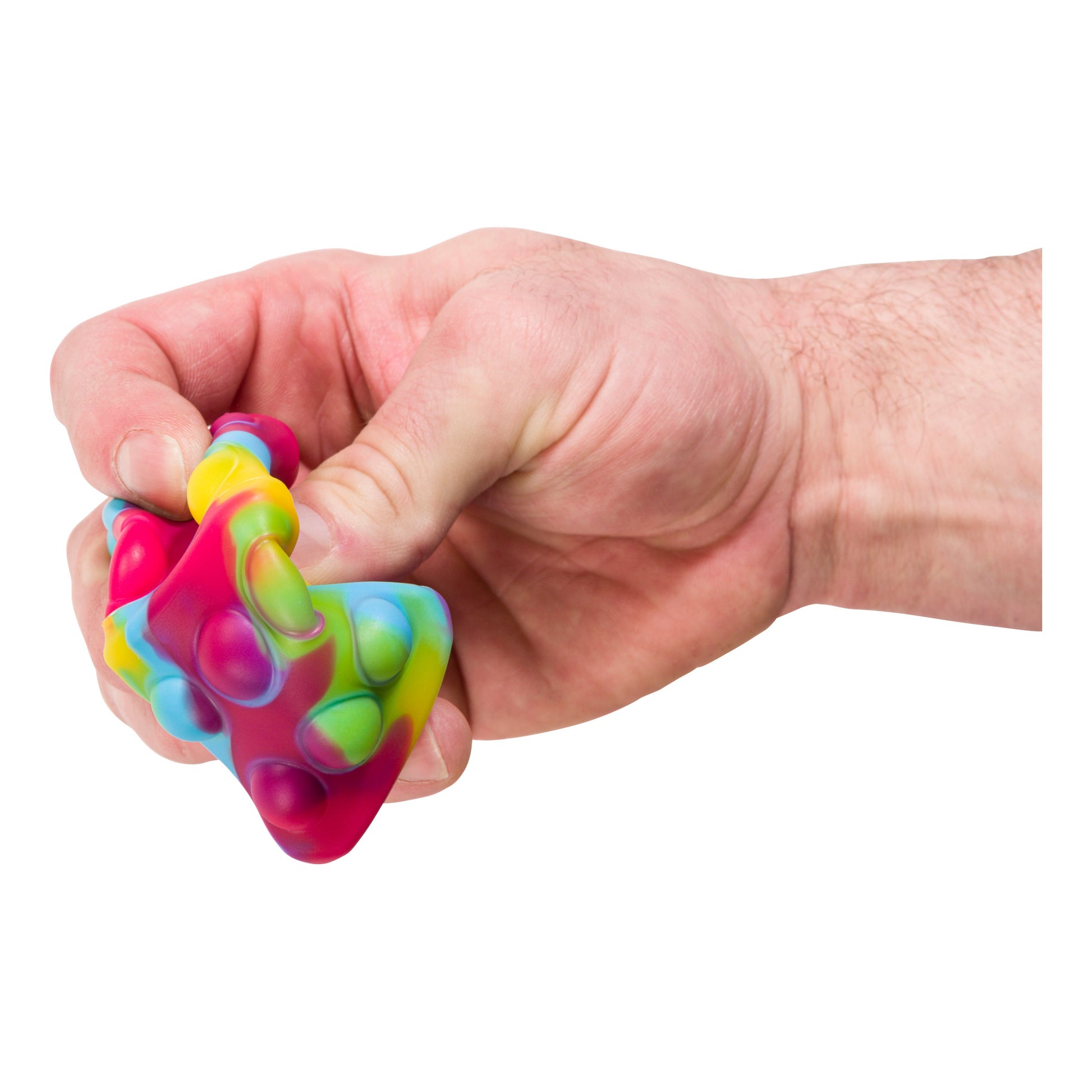 A hand squeezes the Toysmith Poppin' Dice - Rainbow by Toysmith, a colorful sensory toy with bubble-like bumps—perfect as a satisfying fidget toy for stress relief against a white background.