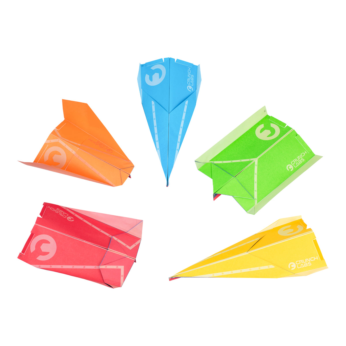 Five colorful paper airplanes—orange, blue, green, red, and yellow—are arranged in a circle on a white background. Each plane, part of the Turbo Trick Flyer STEM toy from the Moose Toys Crunch Labs Crunch Kit, features visible fold lines and Moose Toys branding on the wings.