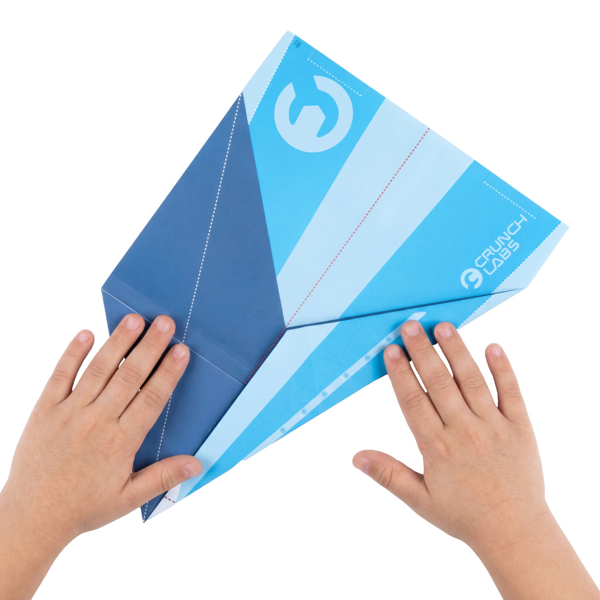 Two hands hold a large blue paper airplane featuring geometric patterns and the Moose Toys logo on it against a white background, highlighting the Crunch Labs Crunch Kit Turbo Trick Flyer—a fun STEM toy from Moose Toys that inspires creativity and exploration.