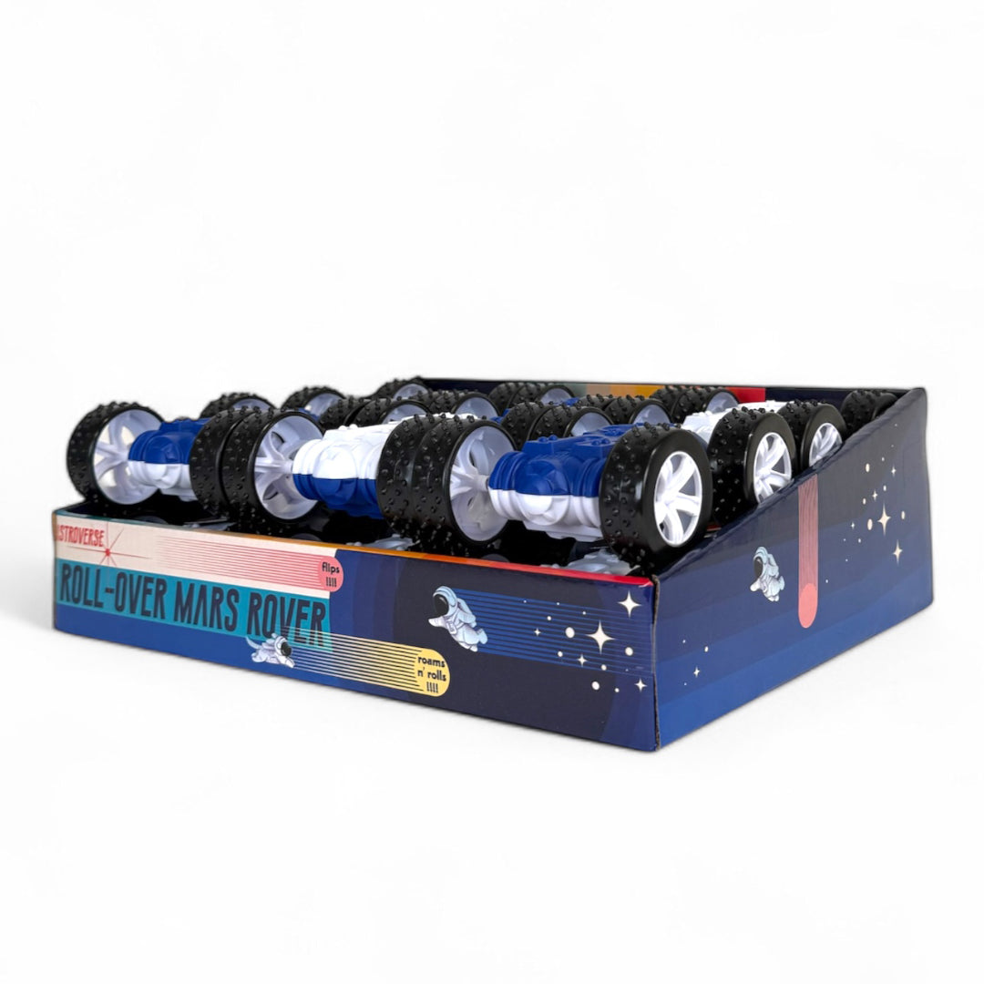 A display box labeled Astroverse Roll Over Mars Rover by Astroverse holds multiple double-sided flip play Mars rover toys with large black wheels and blue and white bodies, set against a white background.