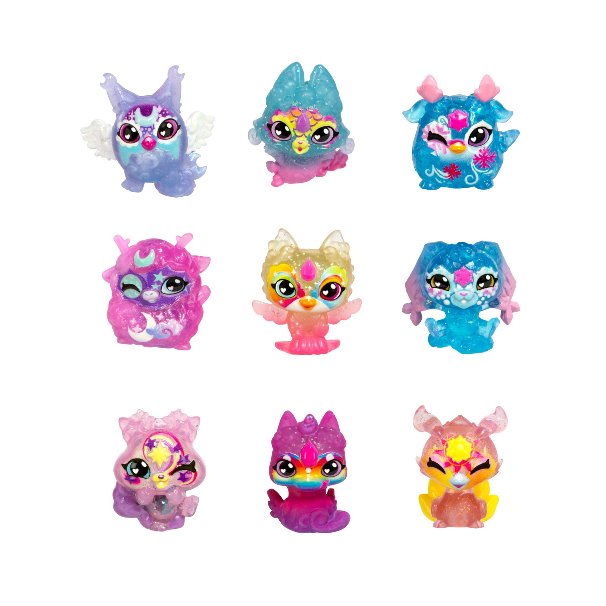 Nine Magic Mixies Mixlings S1 9PK Super Sparkle fantasy figurines are arranged in a 3x3 grid, each with unique features—wings, horns, animal-like ears—and vibrant, sparkly patterns.