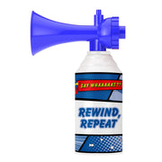 The Say Whaaaaat?! Part Deux - Mini Air Horn by Say Whaaaaat?! features a blue can with a comic-style label—SAY WHAAAAAT?! on top and REWIND, REPEAT in bold blue—perfect for instant laughs and sound effects.