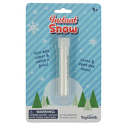 Toysmith Instant Snow by Toysmith comes in a clear tube with white powder. The packaging has snowflakes, trees, and the text "Just add water & watch it grow! Looks & feels like snow!" Great for sensory play or science fun. Ages 5+.