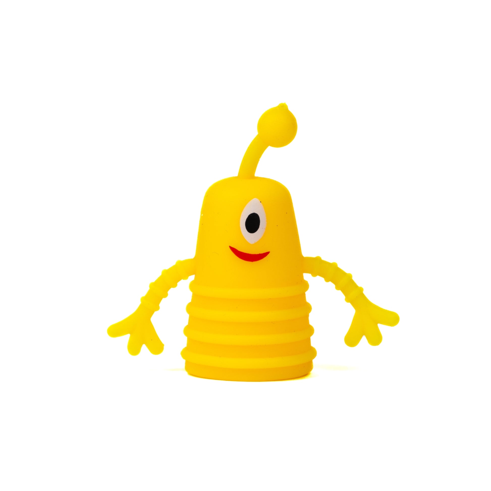 The Toysmith Monster Finger Puppet by Toysmith features a yellow, cone-shaped cartoon figure with one eye, a red smiling mouth, long wavy arms, and an antenna on its head, all set against a white background.