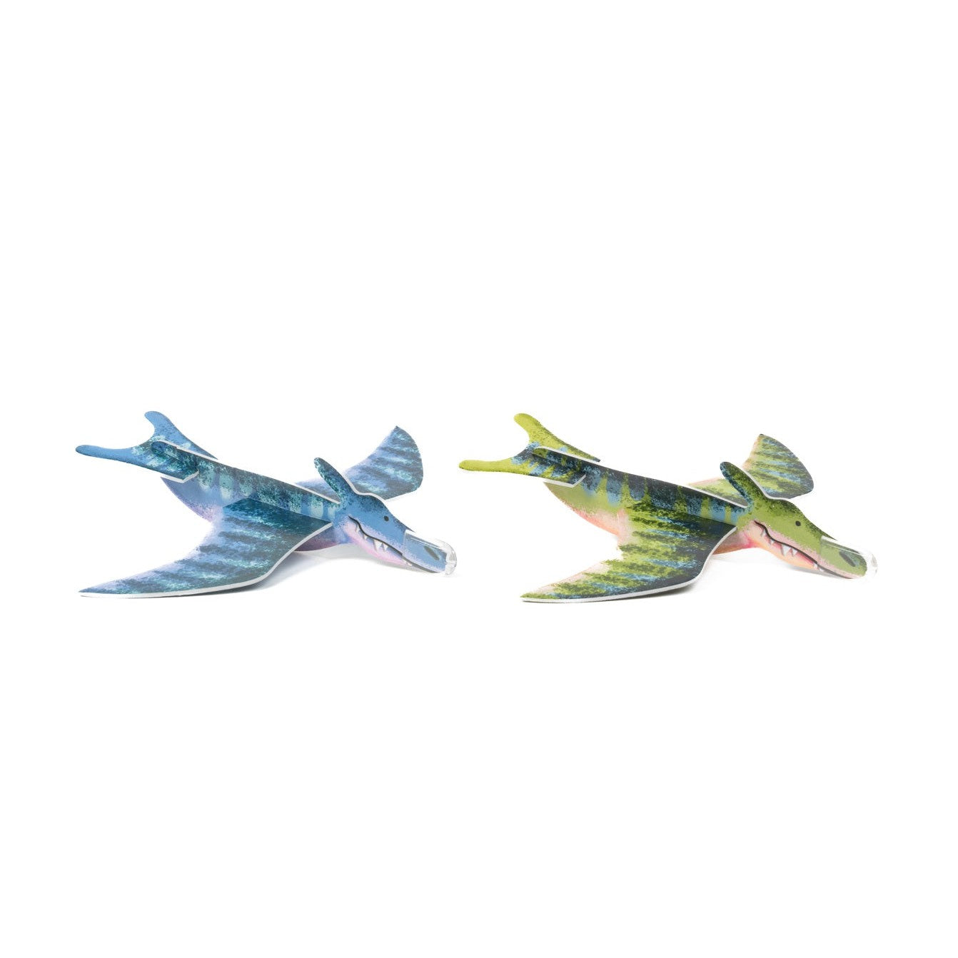 Two Toysmith Dinosaur Gliders, Flying Toy by Toysmith, shaped like blue and green pterodactyls with outstretched wings and open mouths, are positioned side by side on a white background, highlighting their playful design.