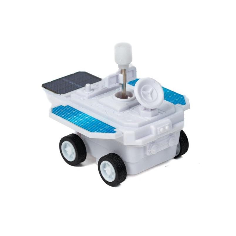 The Toysmith Zero Gravity Rover by Toysmith is a small white magnetic rover with blue solar panels, four black wheels, an antenna, and a dish on top, shown against a white background.