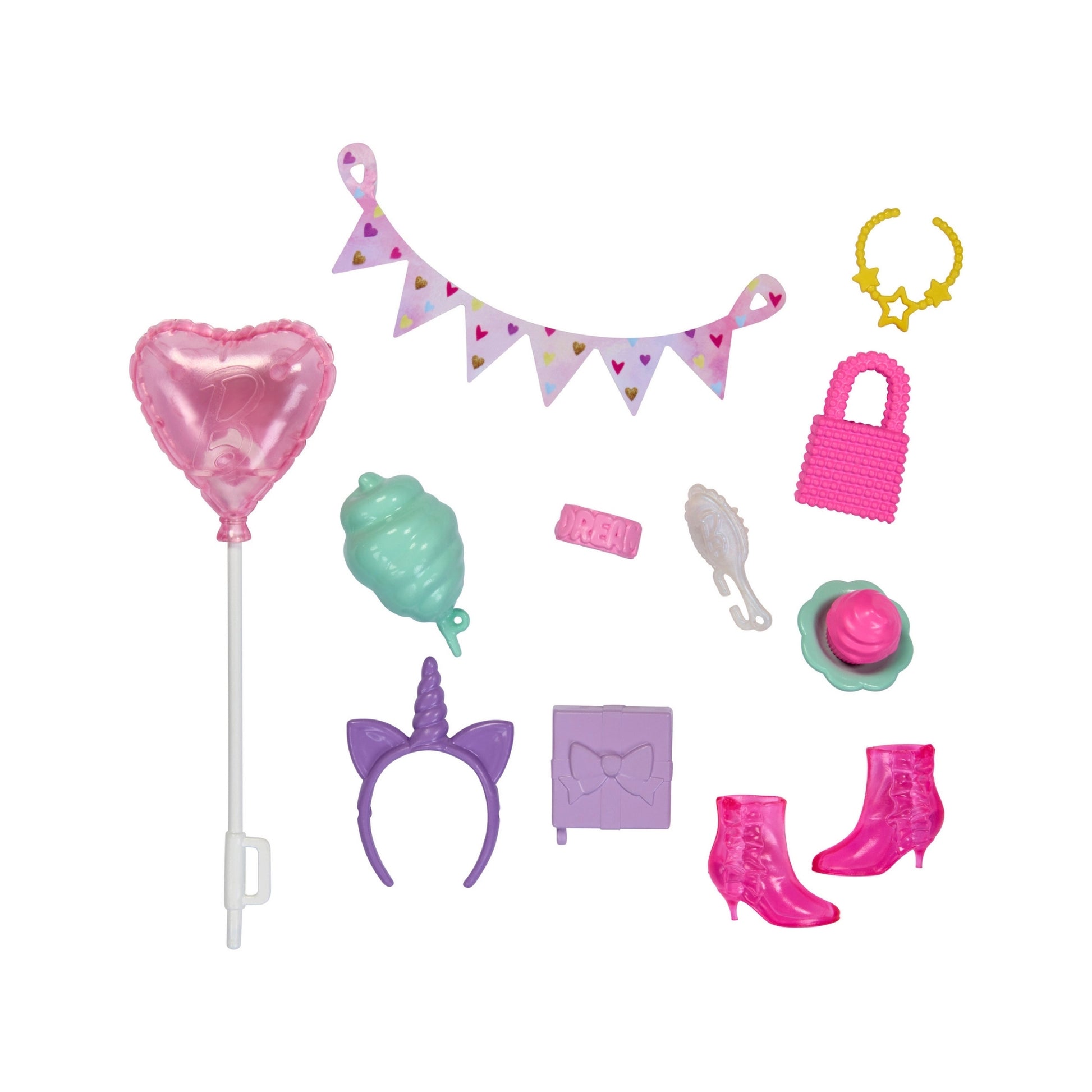 The Mattel Barbie Fashion Storytelling Pack includes a pink heart balloon, purple unicorn headband, pink boots, banner, necklace, purse, cupcake, lollipop, teal treat, small book, and YAY! sign—ideal for creative play!.