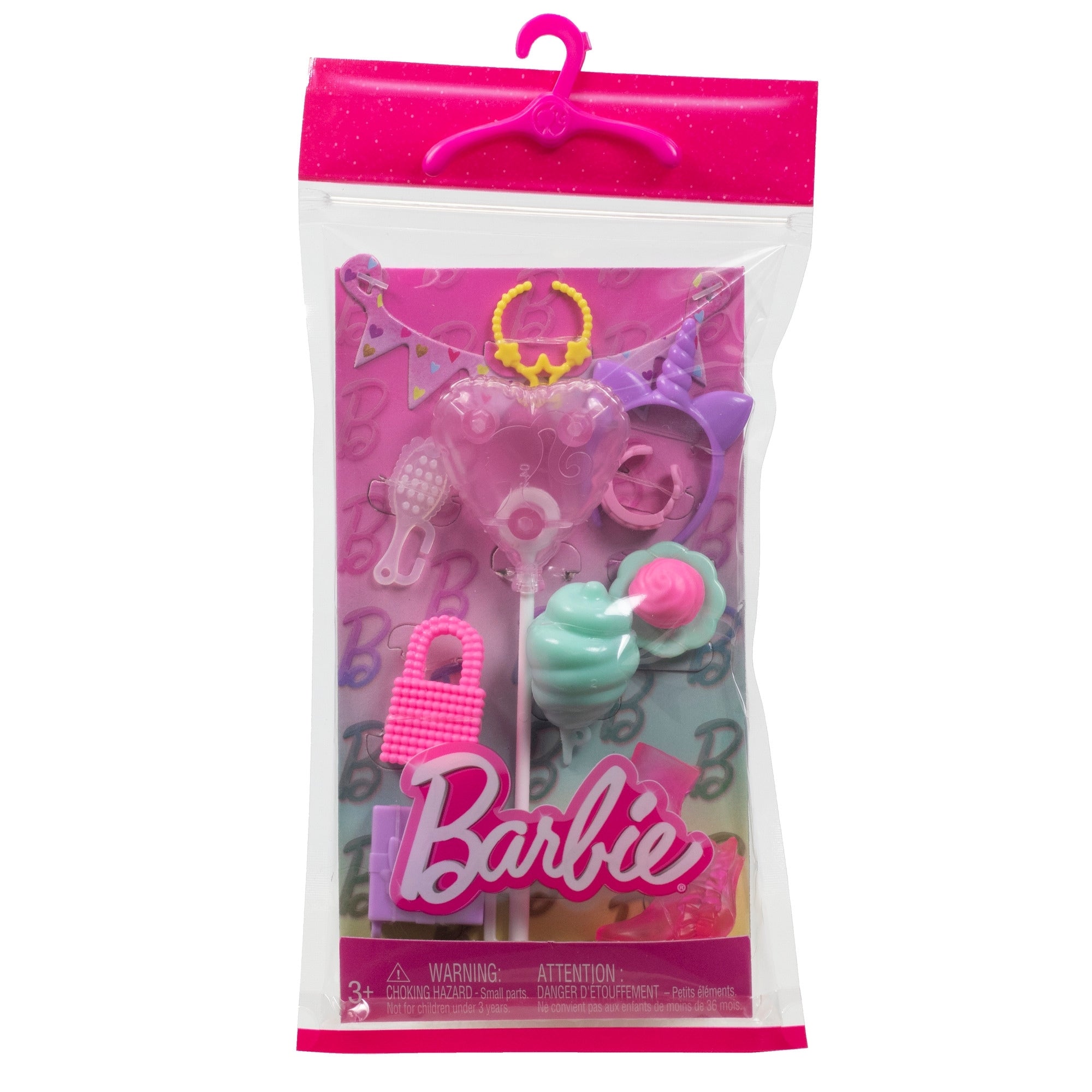 The Mattel Barbie Fashion Storytelling Pack includes a clear pink zippered bag with hanger, unicorn headband, sunglasses, necklace, banner, handbag, and two desserts—perfect accessories for colorful Barbie adventures.