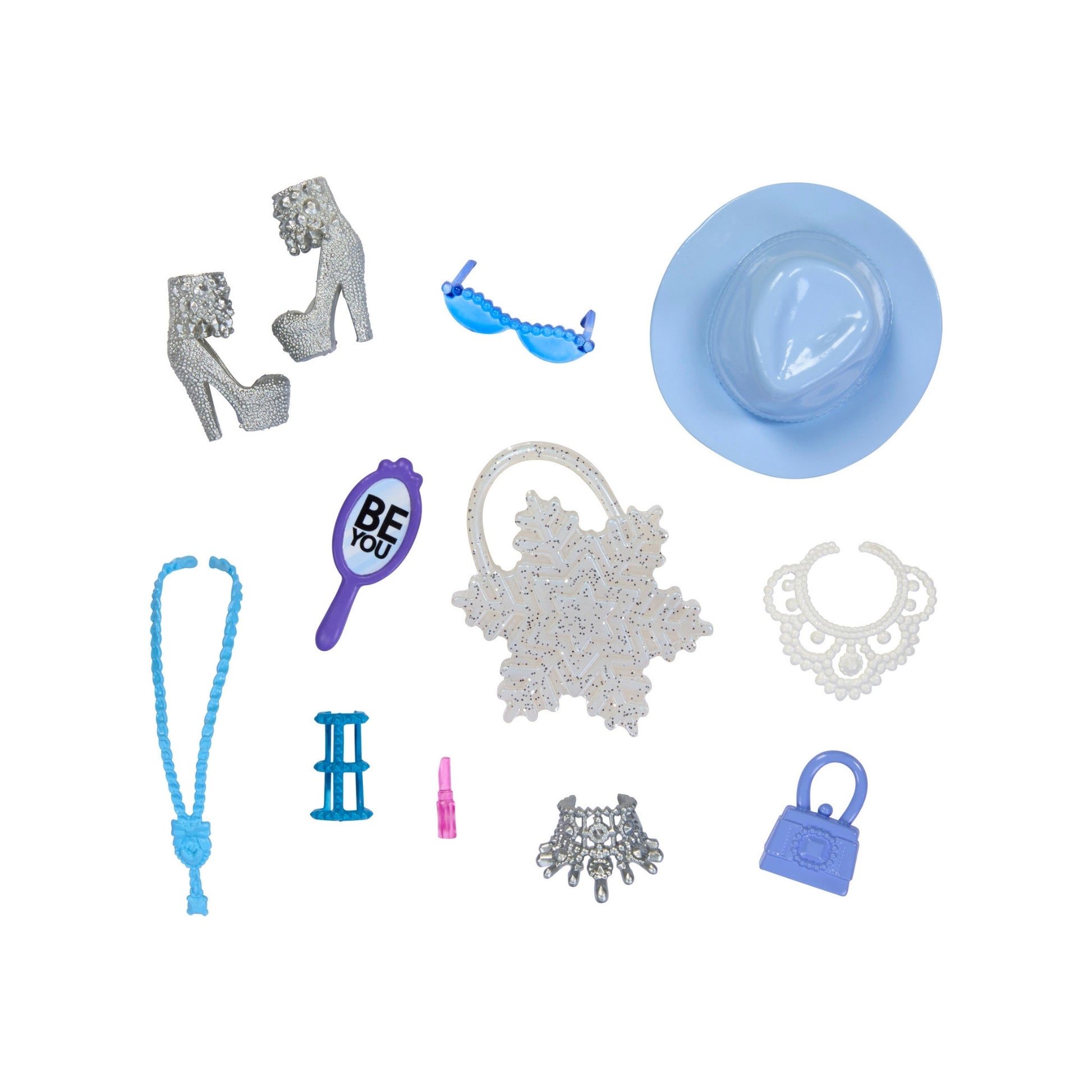 The Mattel Barbie Fashion Storytelling Pack features silver high heels, a blue hat and handbag, jewelry, sunglasses, a mirror, lipstick, and more—arranged on a white background for perfect accessory play.