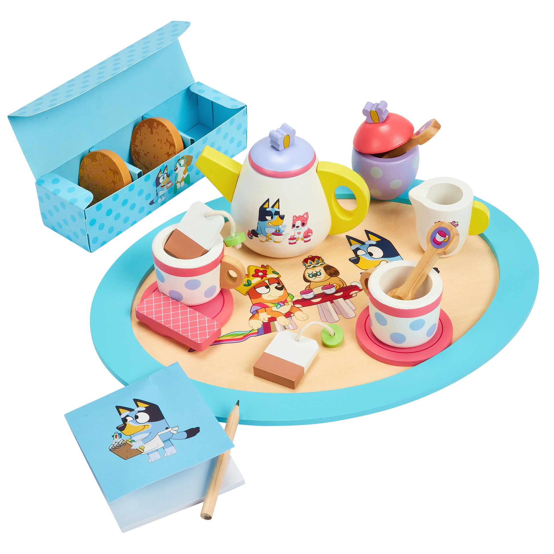 Toy tea set with characters on a round table, including a teapot, cups, and cookies, on a white background.