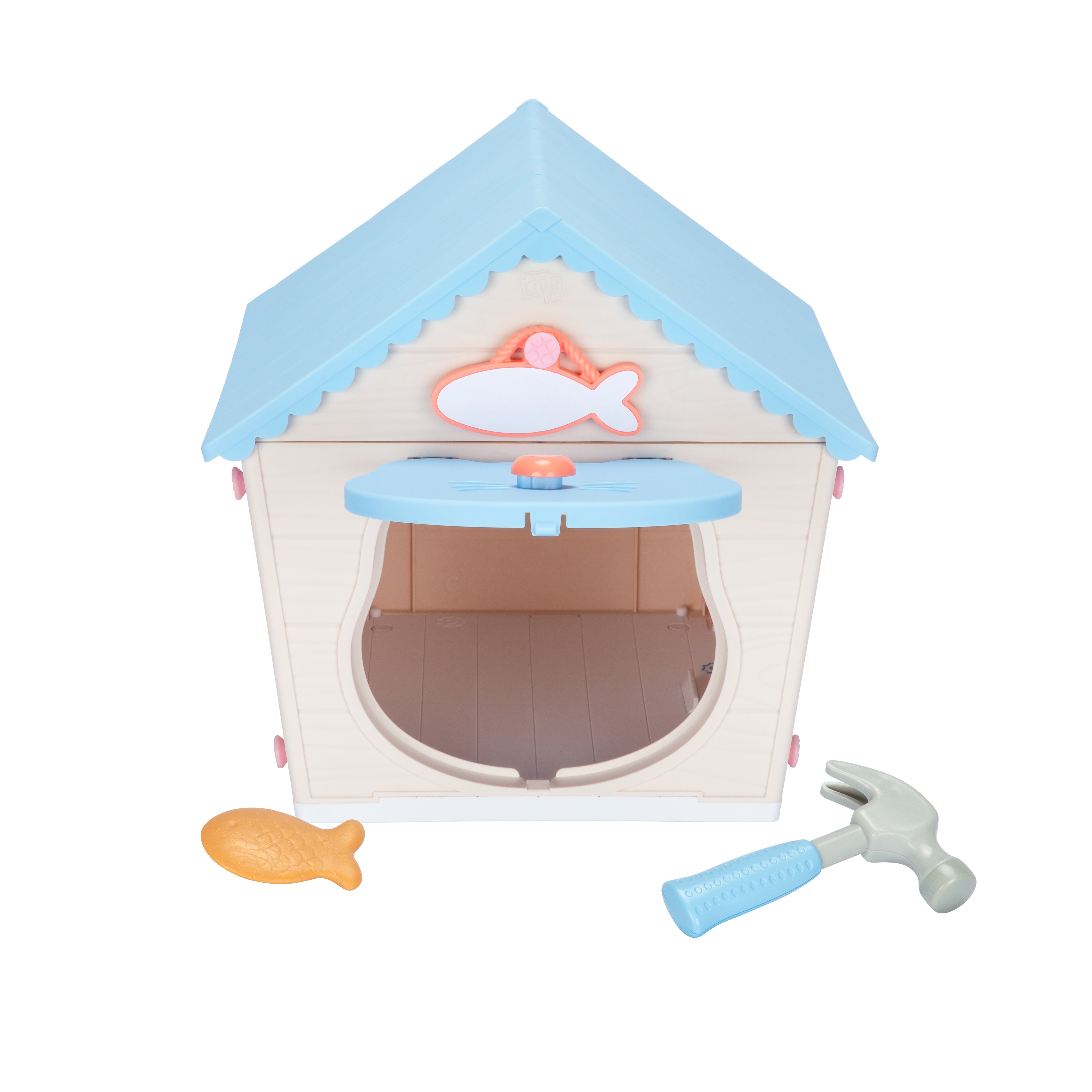 Children's toy house with a blue roof, fish decorations, and a toy hammer on a white background