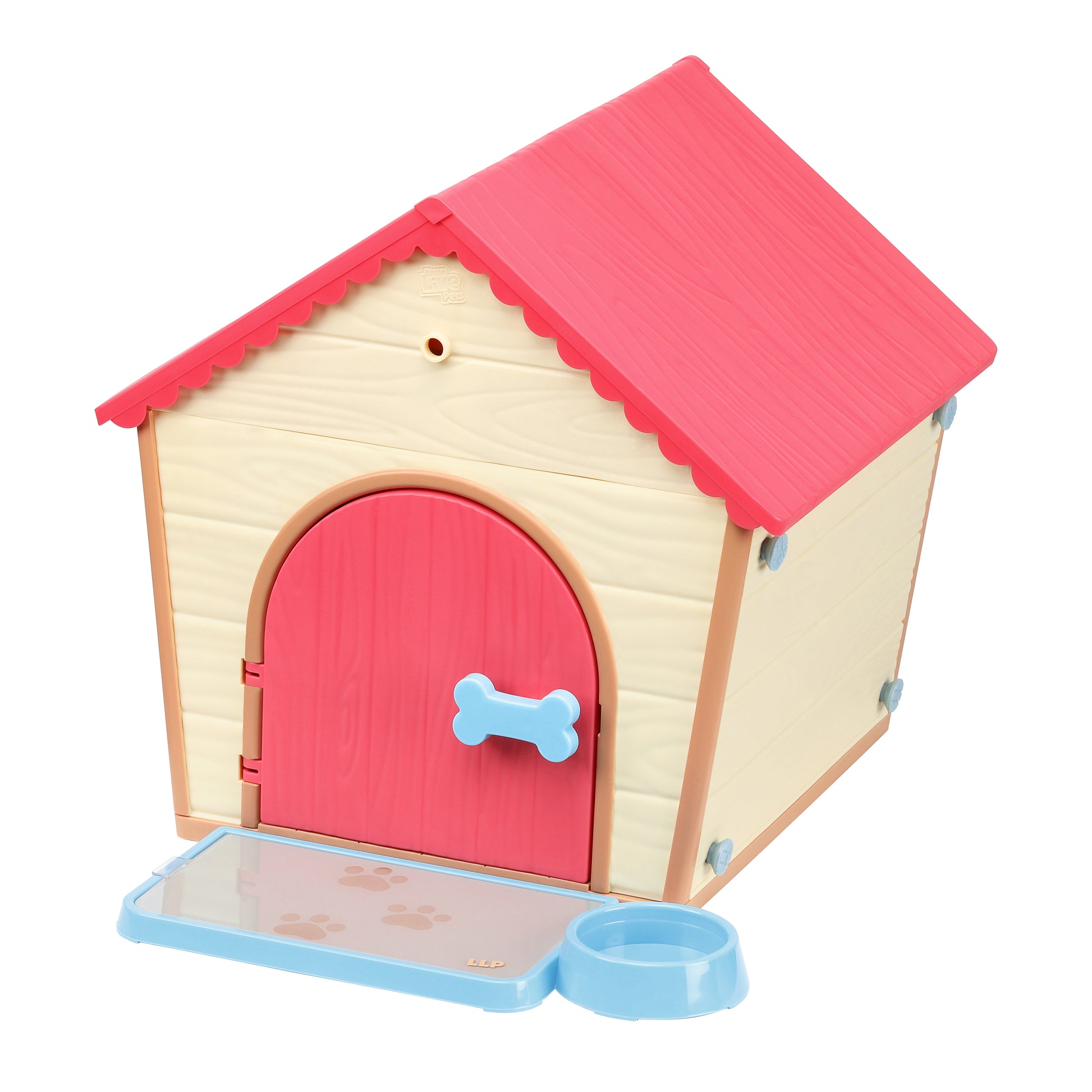 Toy dog house with a red roof and pink door on a white background