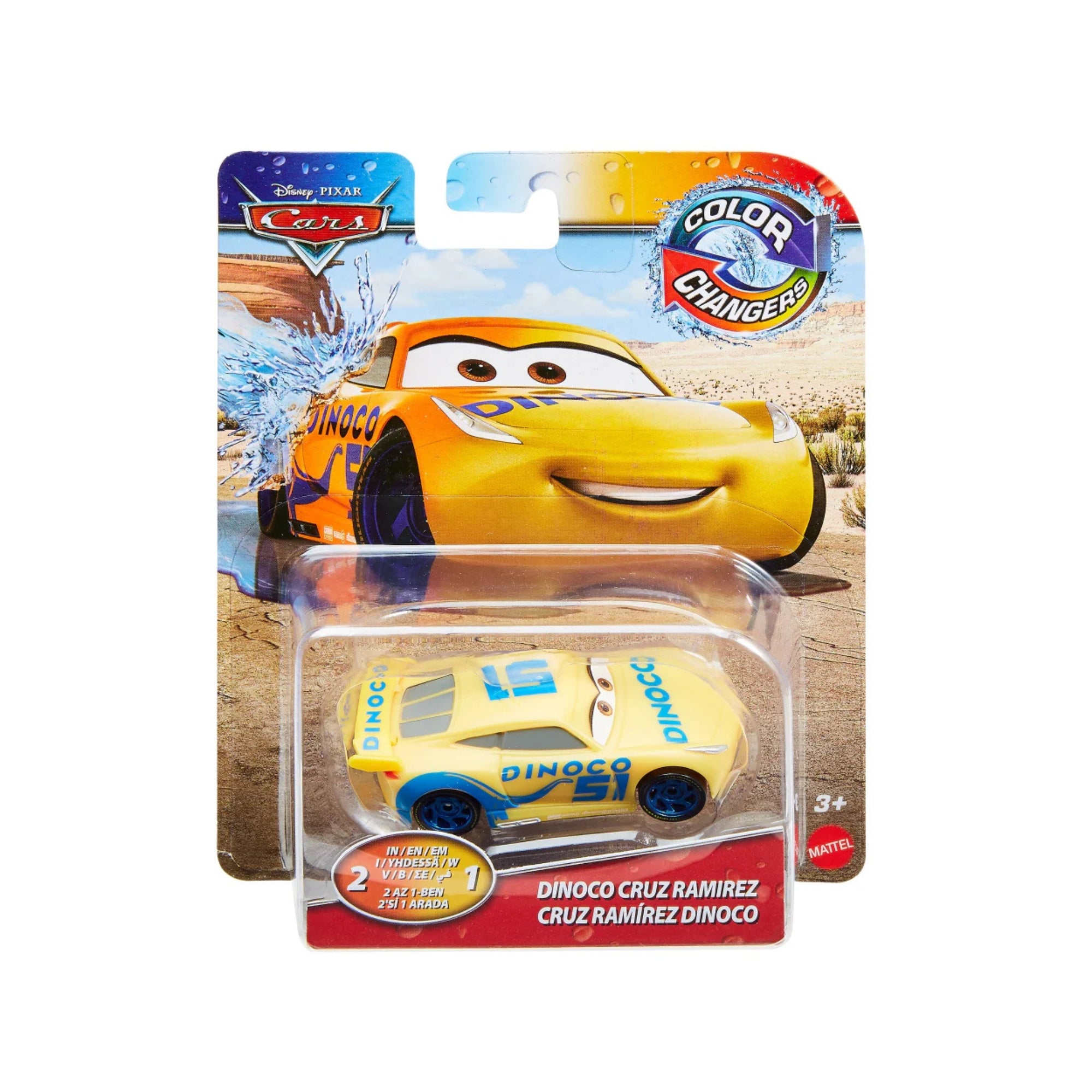 A Mattel Cars Color Changers Dinoco Cruz Ramirez toy, yellow with blue accents, in packaging that shows Cruz Ramirez in a desert scene.