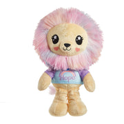 The Mattel Barbie Cutie Reveal Plushie is a plush lion with a pastel pink and purple mane, starry eyes, pink cheeks, and a "Hope" shirt featuring a rainbow, standing upright against a white background.