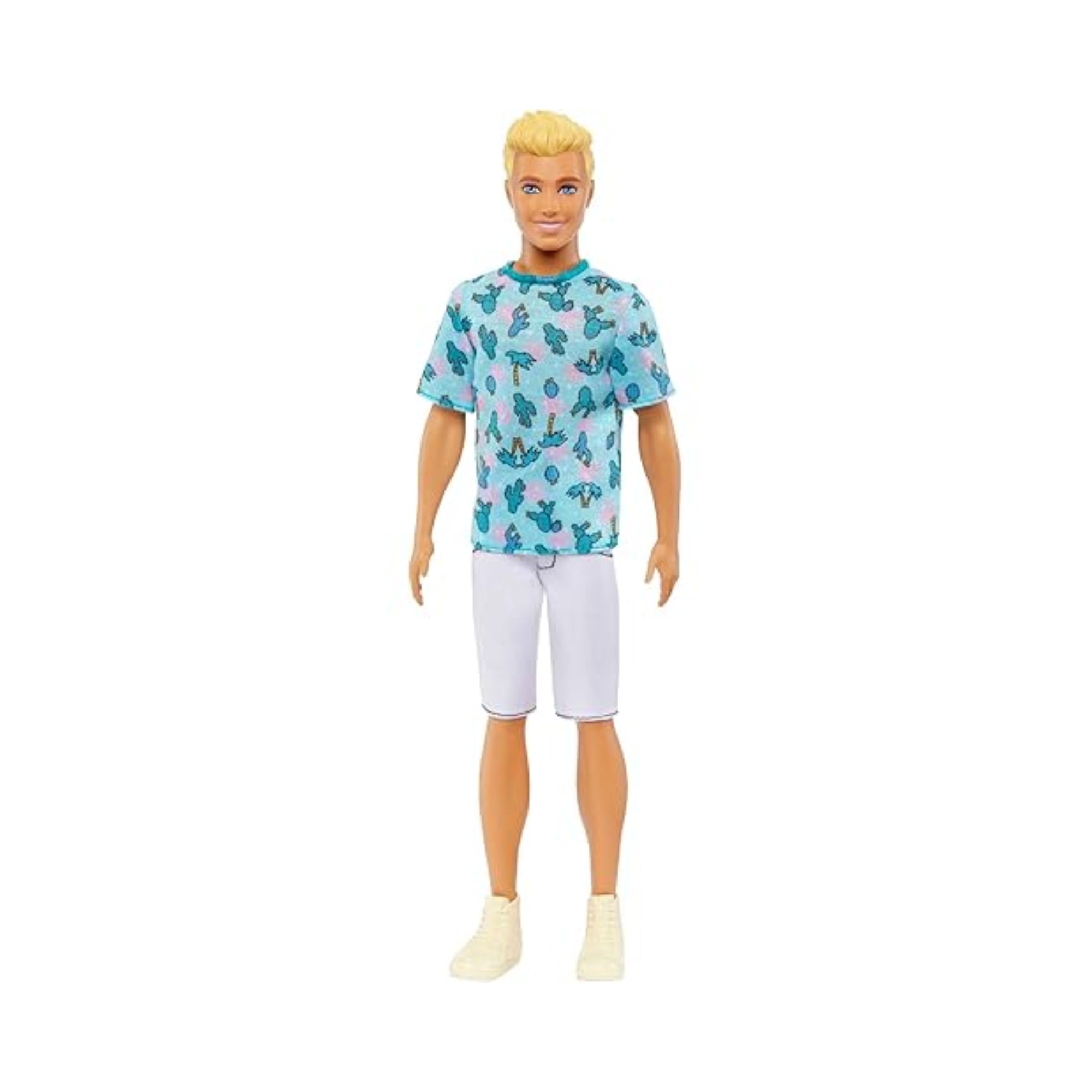 The Mattel Barbie Ken Fashionistas Doll features blonde hair, a light blue cactus-print t-shirt, white shorts, and beige sneakers, shown against a plain white background.