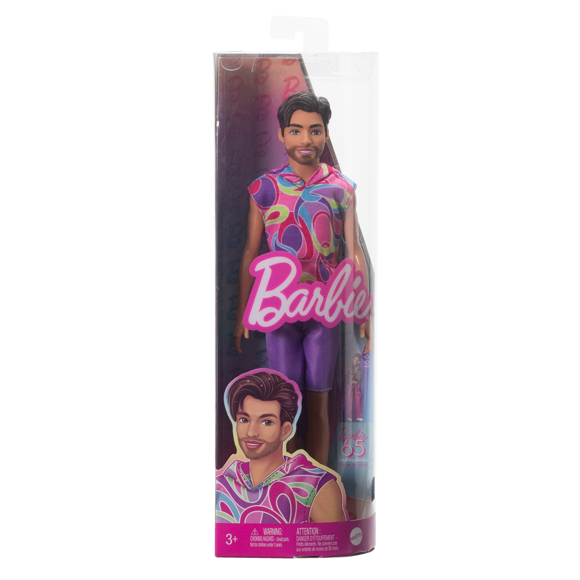 The Mattel Barbie Ken Fashionistas Doll, with brown hair and beard in a colorful sleeveless shirt and purple shorts, comes in a clear Barbie-branded box featuring an illustration of the doll on the lower front.
