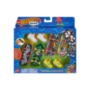 The Mattel Hot Wheels Skate Board & Shoe Pack comes in a colorful blue box with four fingerboards, mini skate shoes, and accessories. The packaging features skateboarding graphics and is recommended for ages 5+.