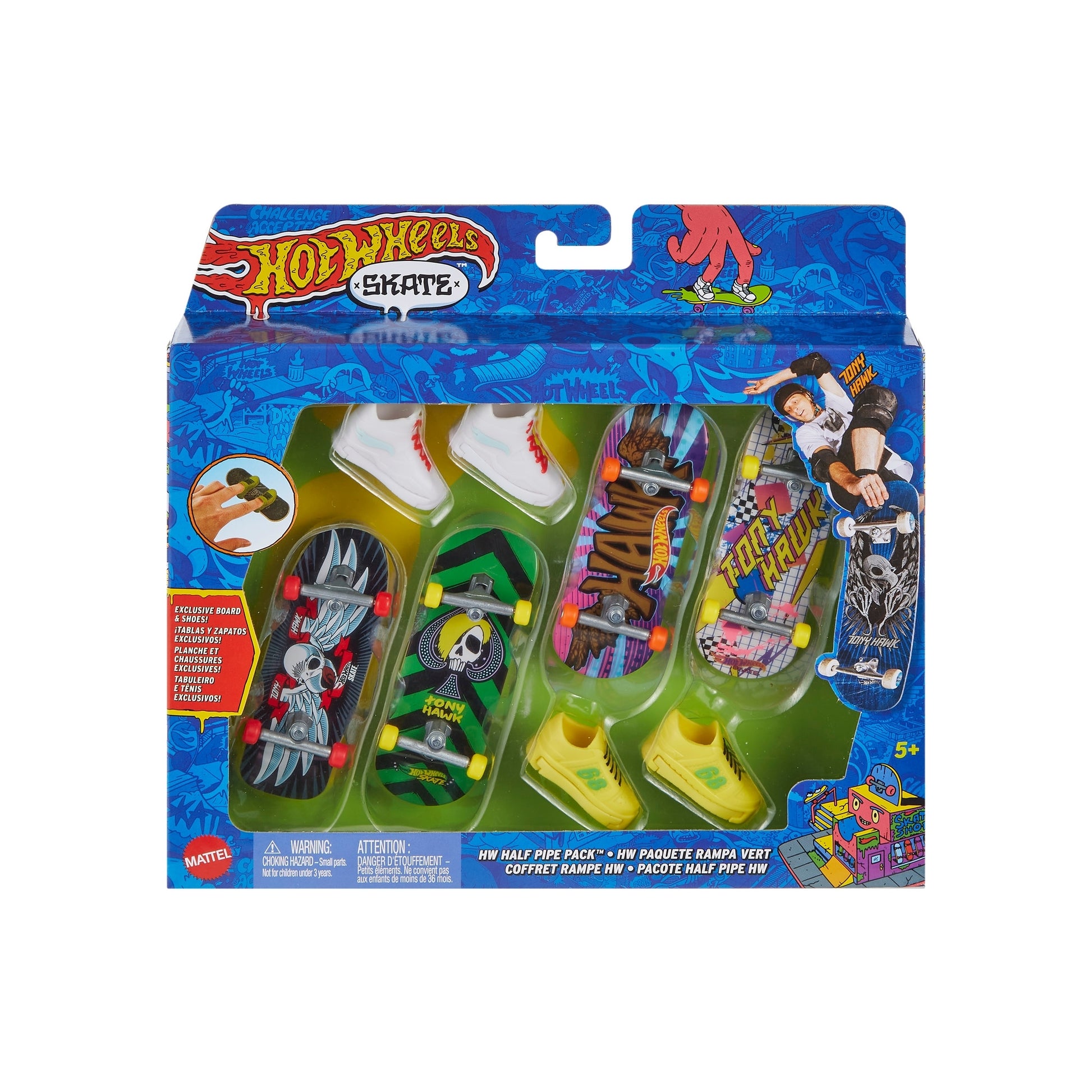 The Mattel Hot Wheels Skate Board & Shoe Pack comes in a colorful blue box with four fingerboards, mini skate shoes, and accessories. The packaging features skateboarding graphics and is recommended for ages 5+.