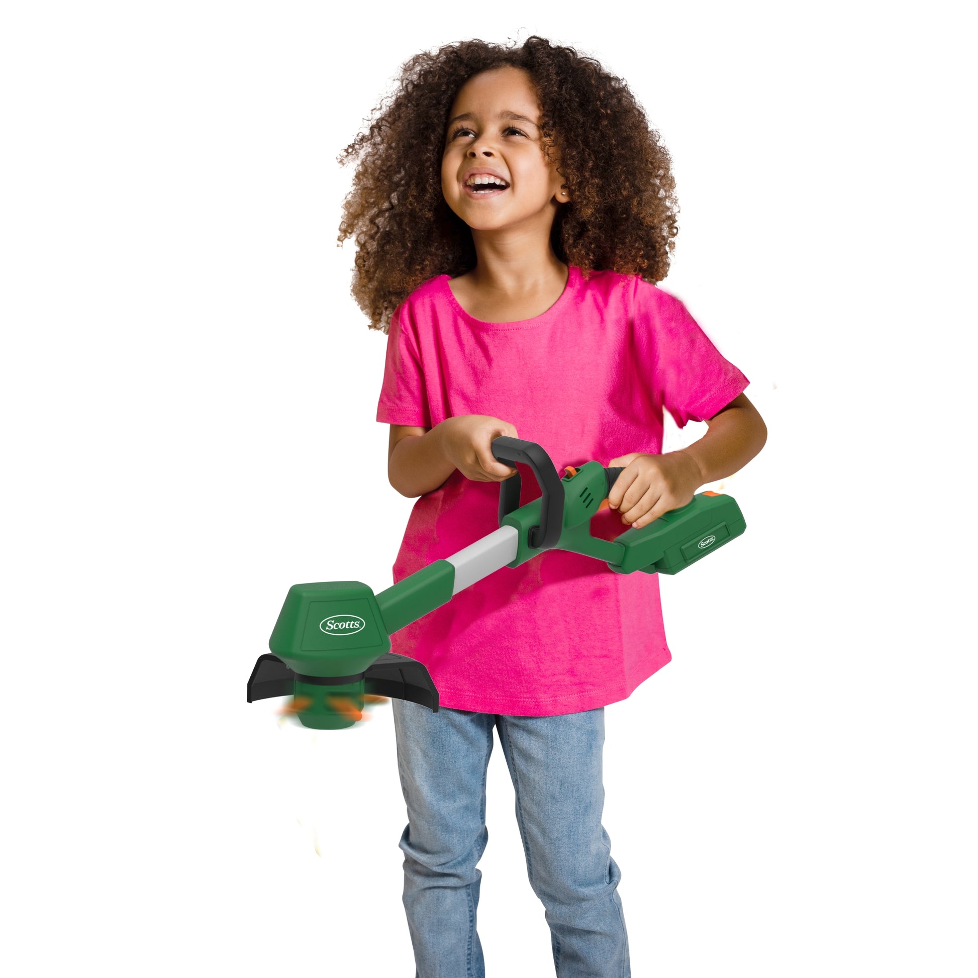 Child holding a green and black toy tool against a white background