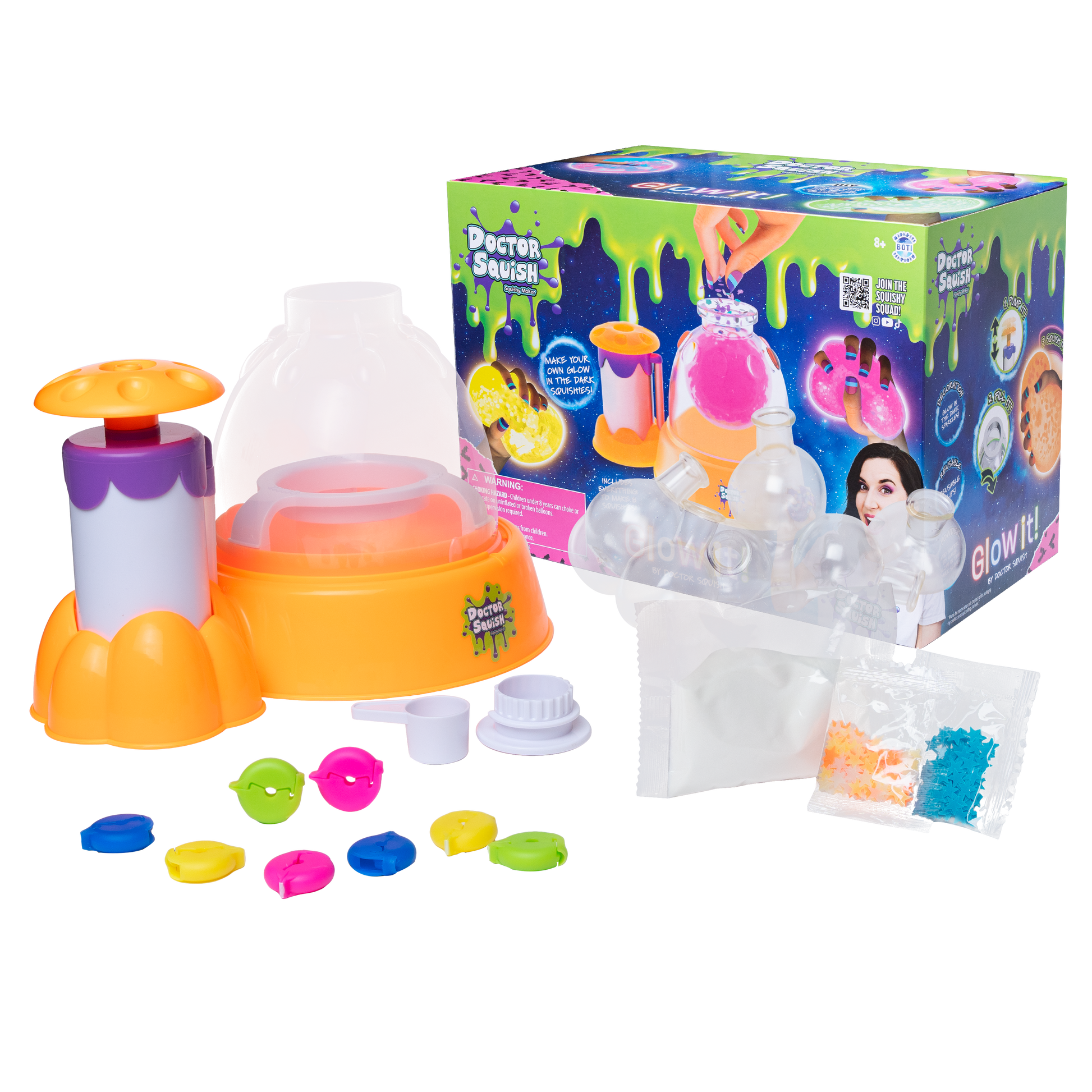 The Dr Squish Squishy Maker Station, Glow It Edition, is shown with its box, a round orange and purple station, clear domes, colorful parts, slime packets, and accessories—everything needed to make your own glow-in-the-dark squishies.
