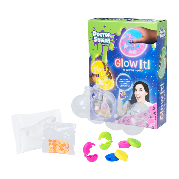 A Doctor Squish Squishy Pack Refill, Glow-It Edition is shown with its vibrant box, plastic capsules, powder and bead packets, and glowing squishies—ideal for adding to your collection or refilling your squishy fun.
