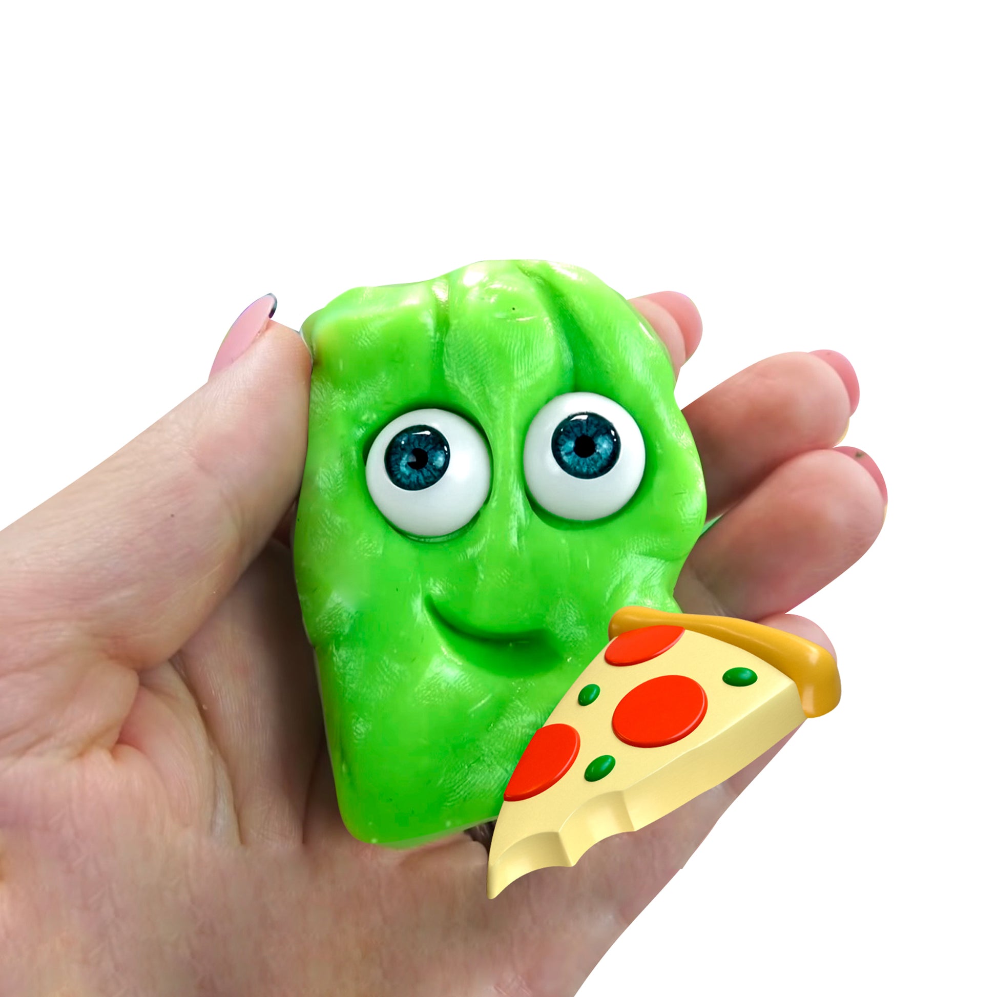 A hand holds a green, blob-shaped Doctor Squish Putty Buddies Asst. 21ct CDU toy with big blue eyes and a smiling face, as an illustrated slice of pepperoni pizza sits in front of it.