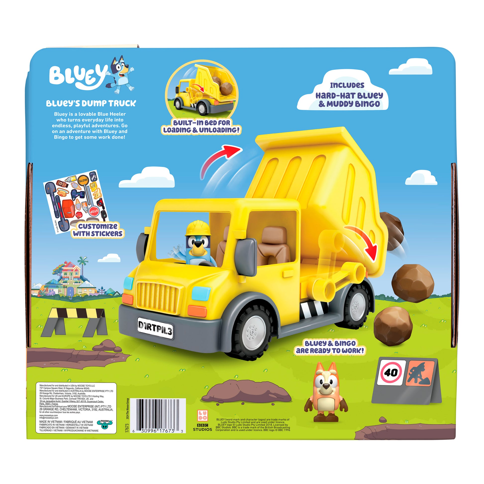 The image shows the back of a Bluey Dump Truck package, featuring the yellow dump truck, a Hard-Hat Bluey figure, and a Muddy Bingo figure. The background displays rocks and a construction scene.