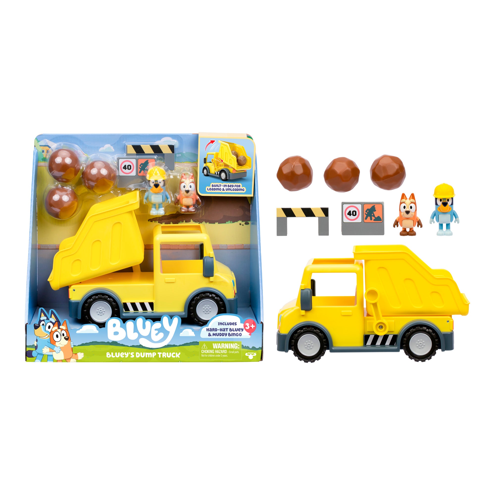 Bluey Dump Truck toy set in packaging includes a yellow dump truck, two character figures, a construction barrier, two signs, and four boulders. Suitable for ages 3 and up.