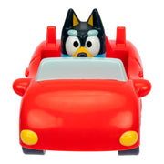 Toy car with a character in the driver's seat on a white background