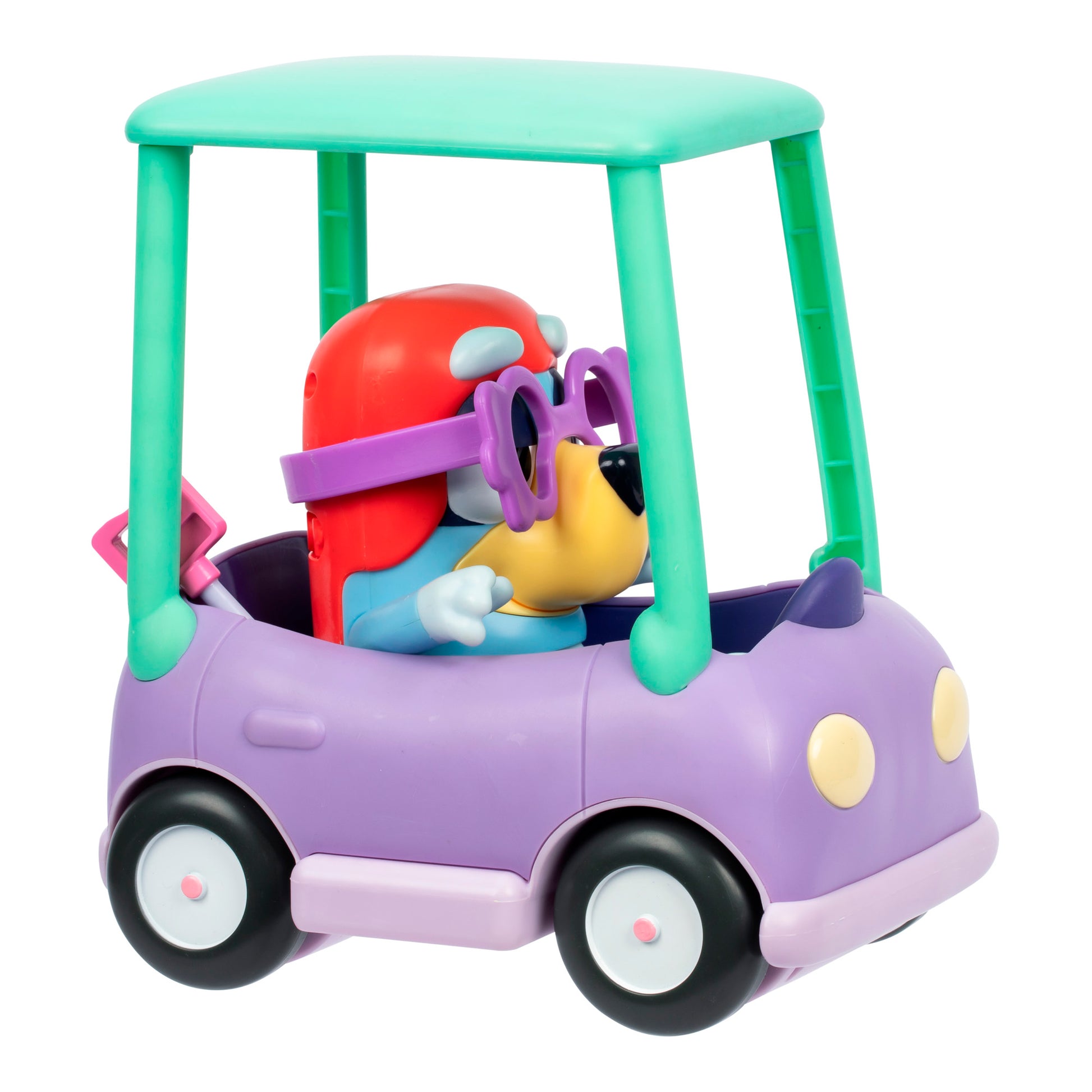 The Bluey Chat Mates Janet Playset features a colorful toy dog with purple sunglasses and a red hat, sitting in a purple toy car with a turquoise roof, viewed from the side against a white background.