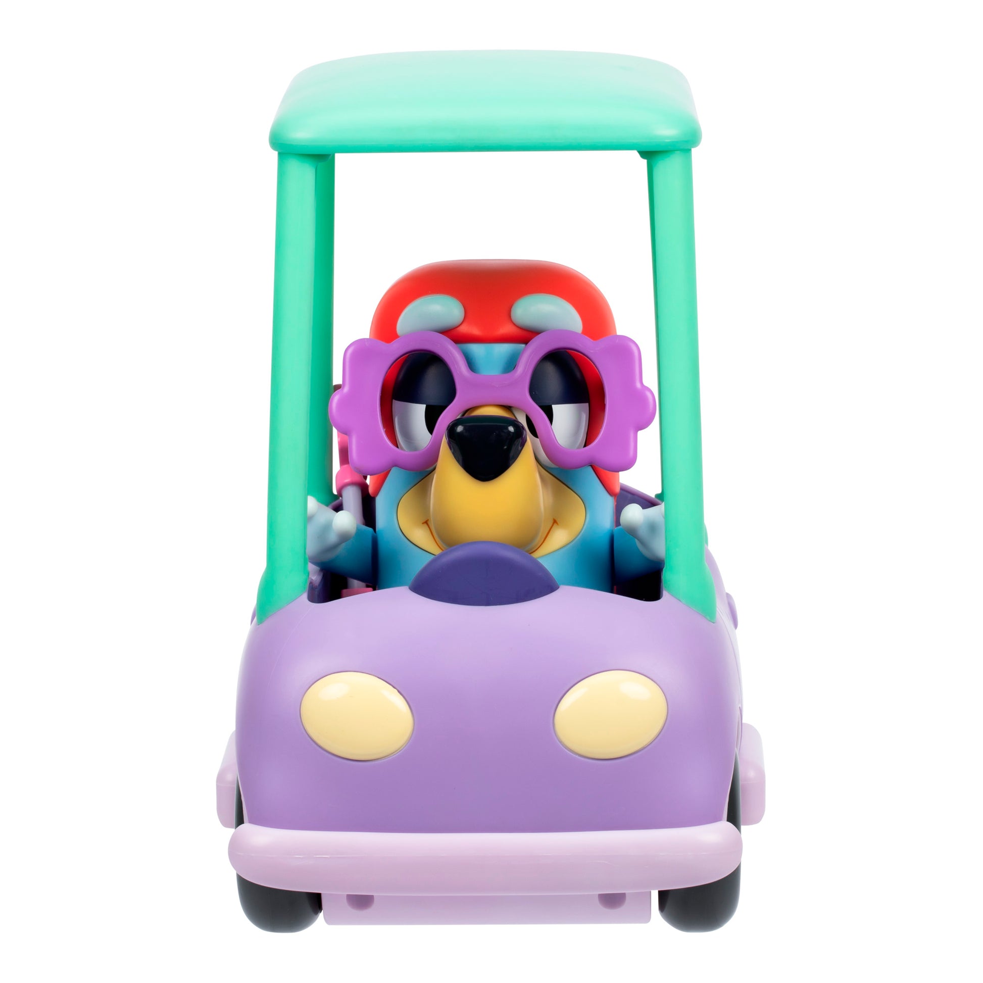 The Bluey Chat Mates Janet Playset features a cartoon dog in pink flower glasses sitting in a pastel toy car with a purple body, green roof, and red seat, facing forward.