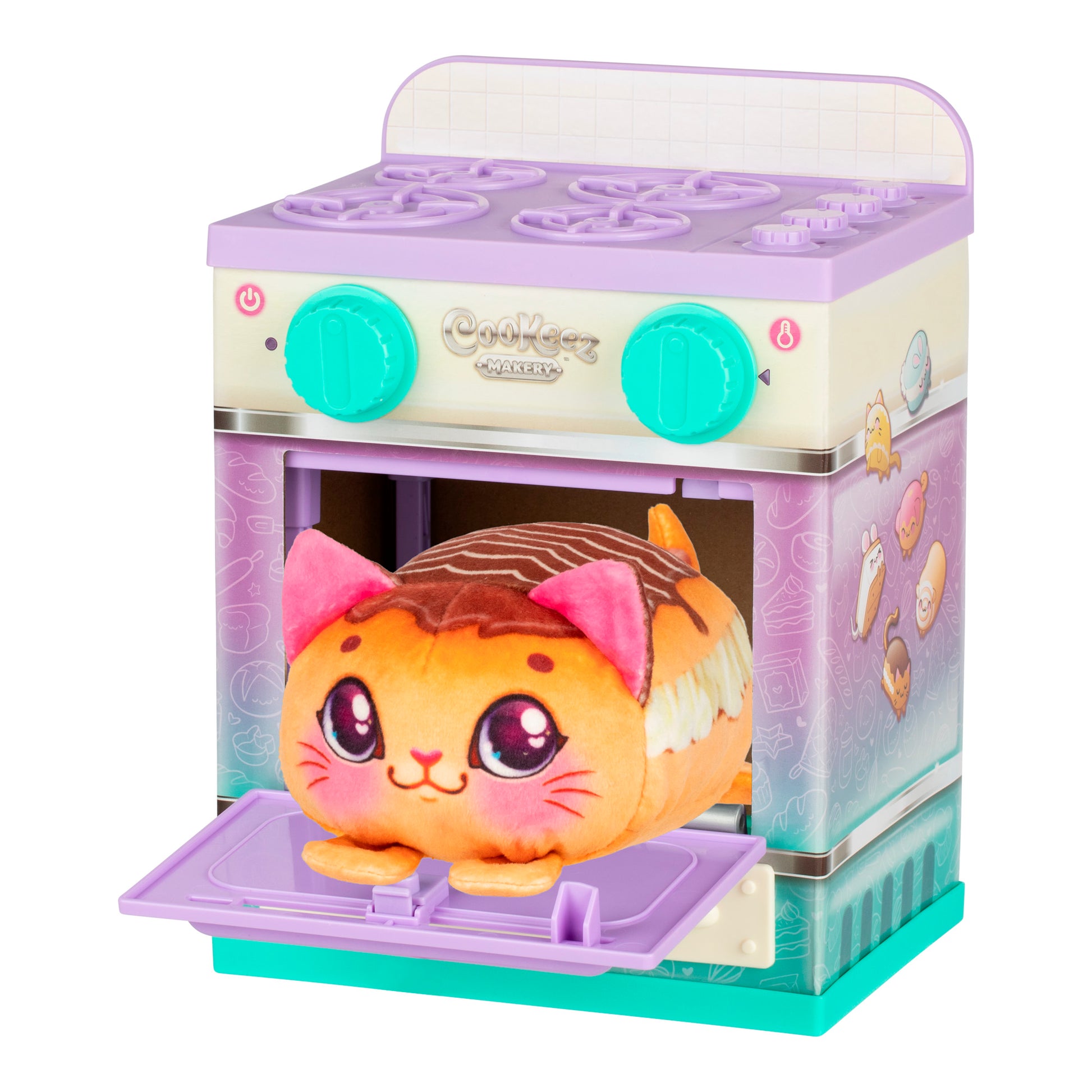 The Cookeez Makery Lil' Bakez Playset features a plush cat toy in orange and pink that sits inside a small, pastel-colored toy oven with an open door, illustrated controls, and adorable dessert-themed decorations.