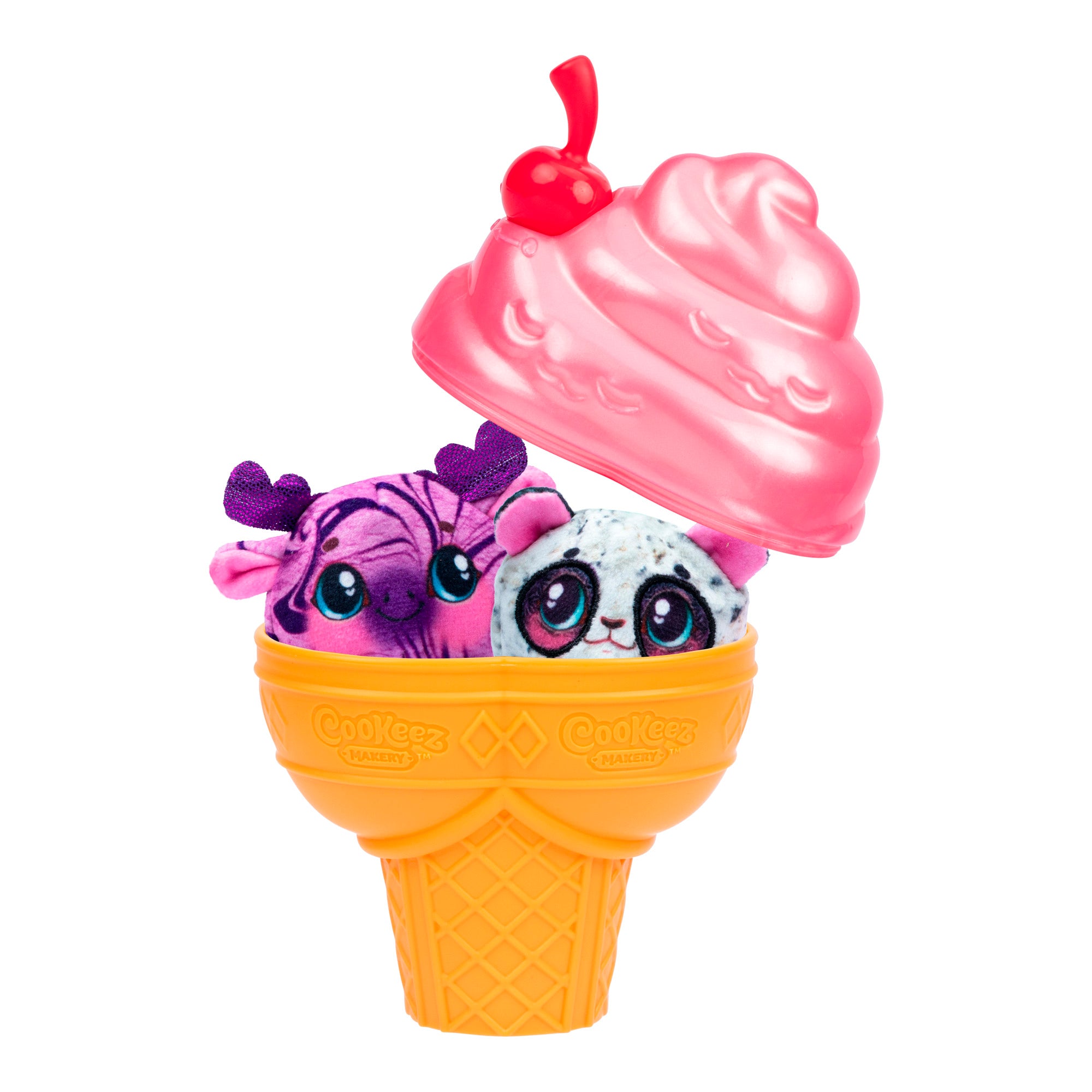 The Cookeez Makery Yum Yumz 2 Pack includes two small plush toys with big eyes, purple and white, featuring different animal designs. They come inside an orange waffle cone topped with a pink ice cream lid and a red cherry.