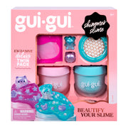 The Gui Gui Shimmer Deluxe Duo Pack includes two tubs of pink and blue slime, bear-shaped charms, pearl beads, and fun accessories in a decorative pink and blue box with playful designs.