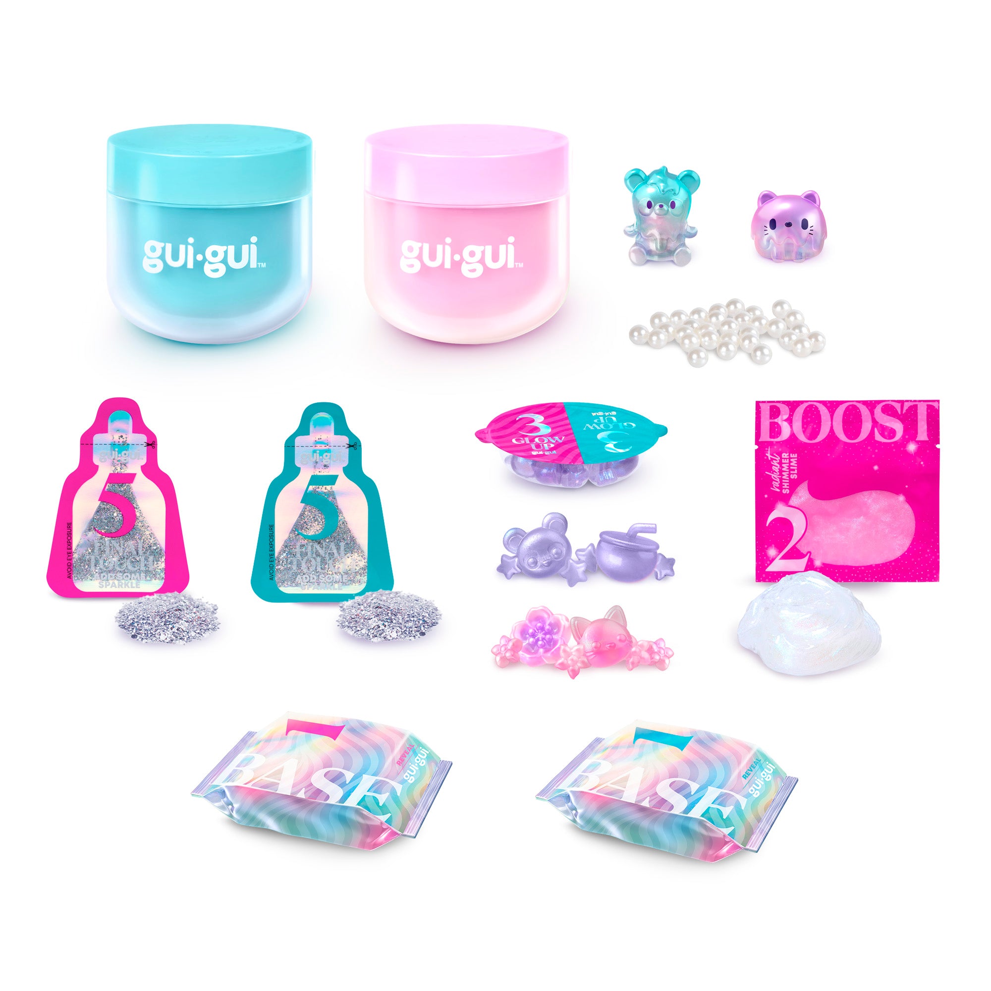 The Gui Gui Shimmer Deluxe Duo Pack features two pastel gui.gui. containers, small animal figurines, shiny beads, glitter packets, and two tie-dye pouches, all arranged on a white background.