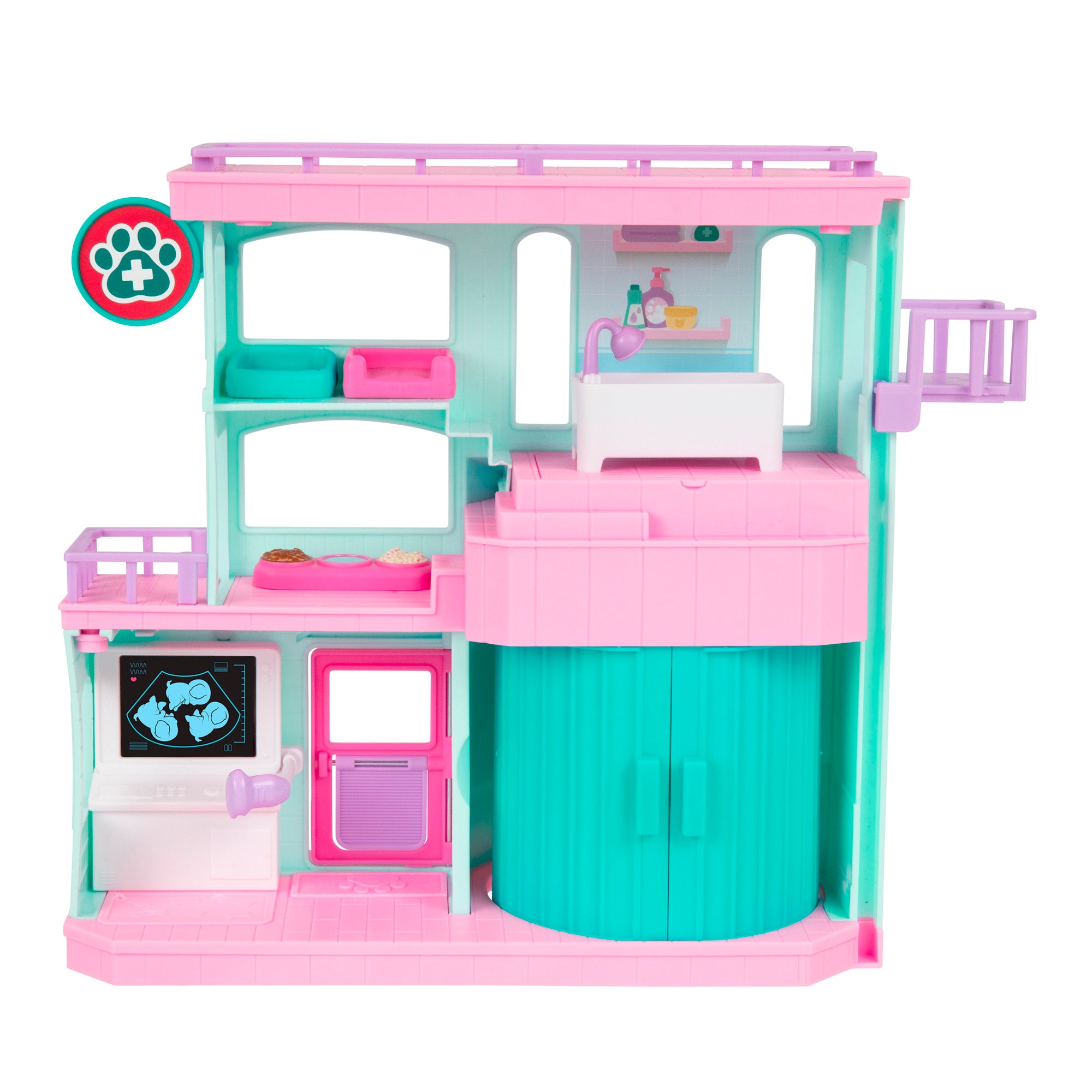 The LLP Mama Surprise Families Veterinarian Playset is a colorful plastic clinic with teal, pink, and white accents. It includes an exam table, x-ray screen, shelves, pet beds, sink, and a paw print medical sign in the top left corner.