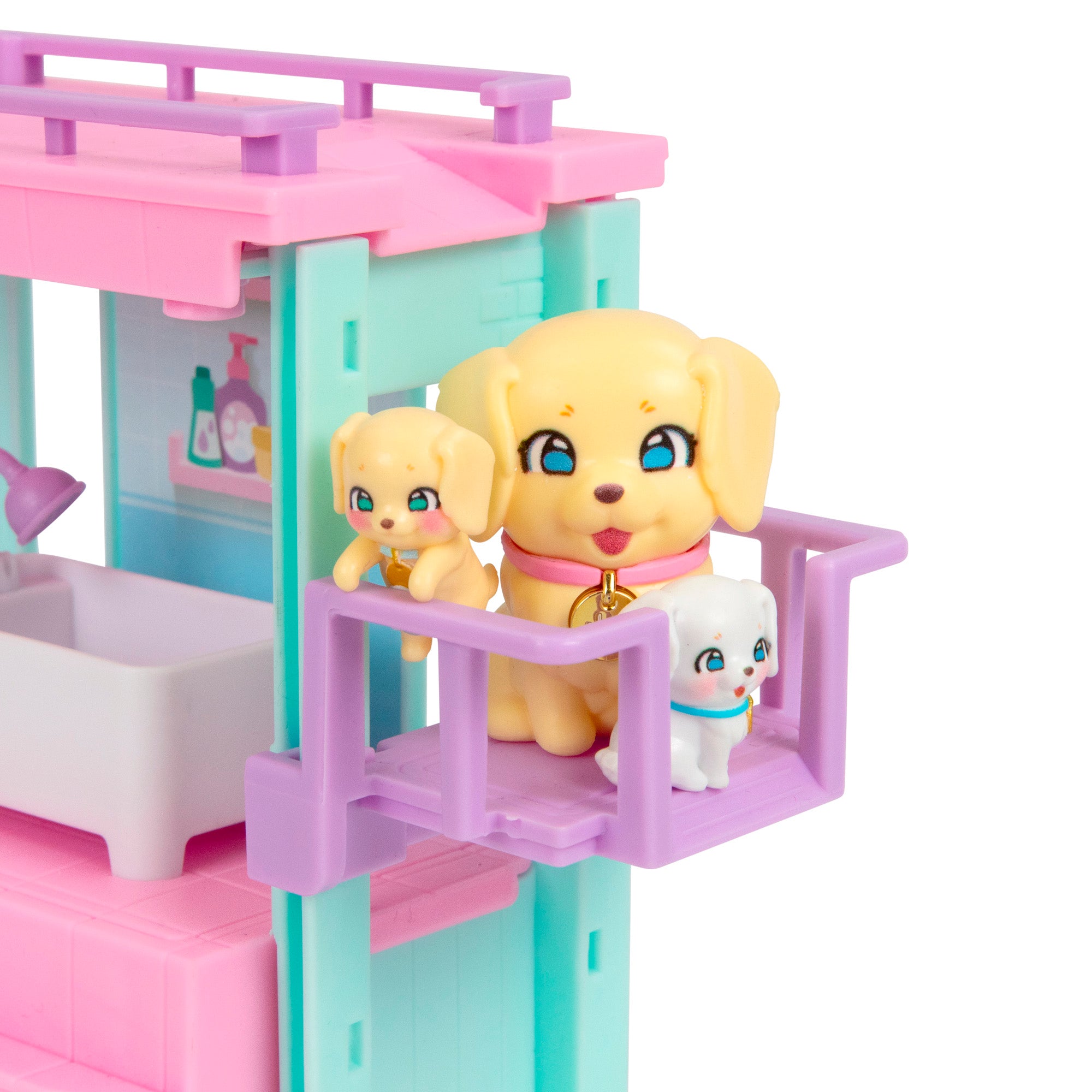 Three toy dogs—a large yellow, a small yellow, and a small white puppy—stand on a purple balcony of the LLP Mama Surprise Families Veterinarian Playset, which features a pastel theme with a bathtub and illustrated background.