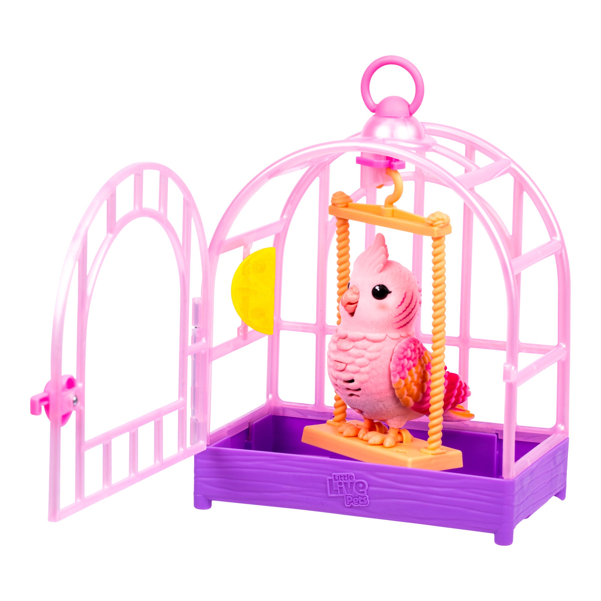 The Little Live Pets My Real Bird & Cage Playset features a pink and purple birdcage with an open door, a handle on top, and a pink and orange bird perched on a yellow swing inside.
