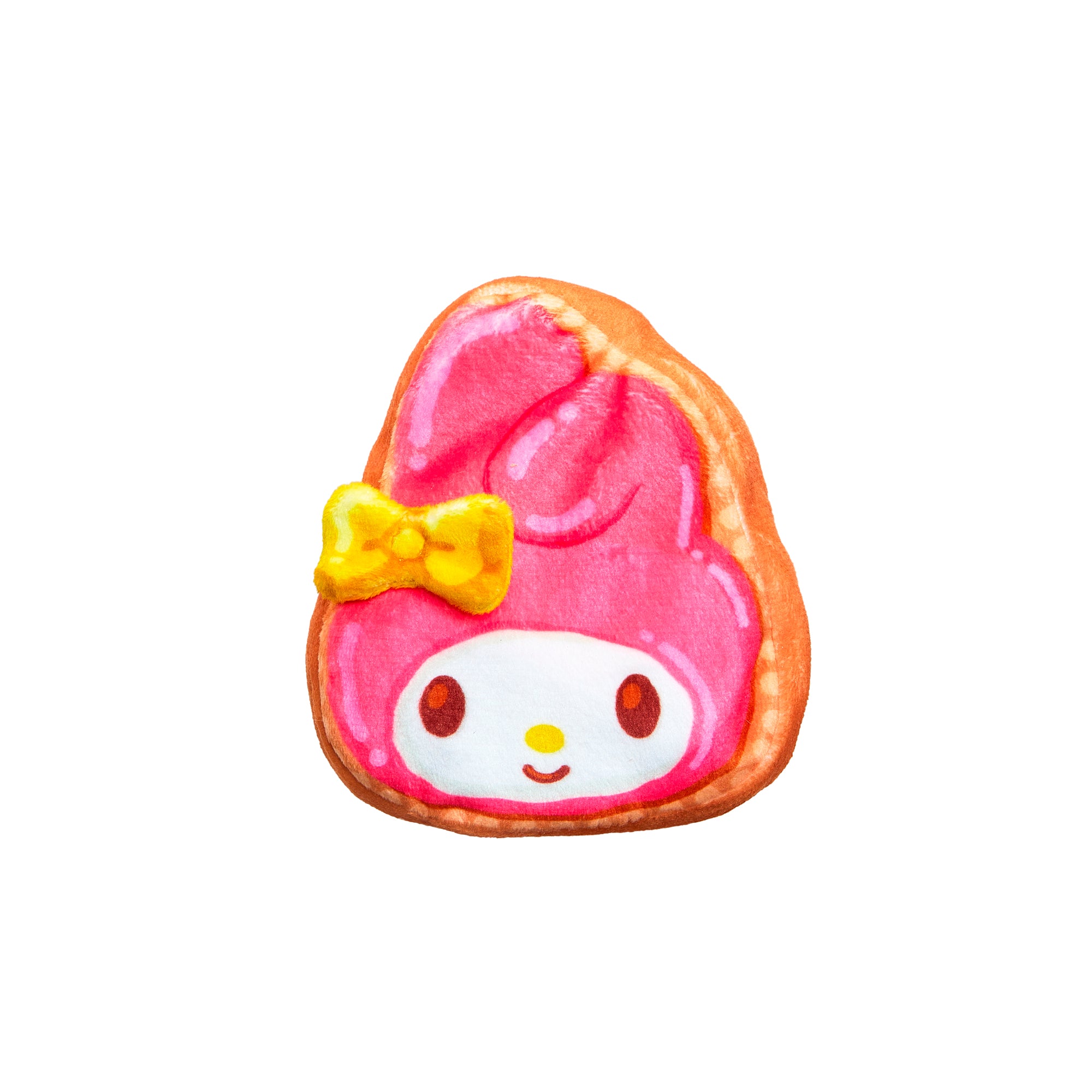 The Cookeez Makery Hello Kitty & Friends Toasty Treatz is a cookie featuring a pink cartoon face with a yellow bow and white hood, resembling a Sanrio breakfast treat, displayed on a plain white background.