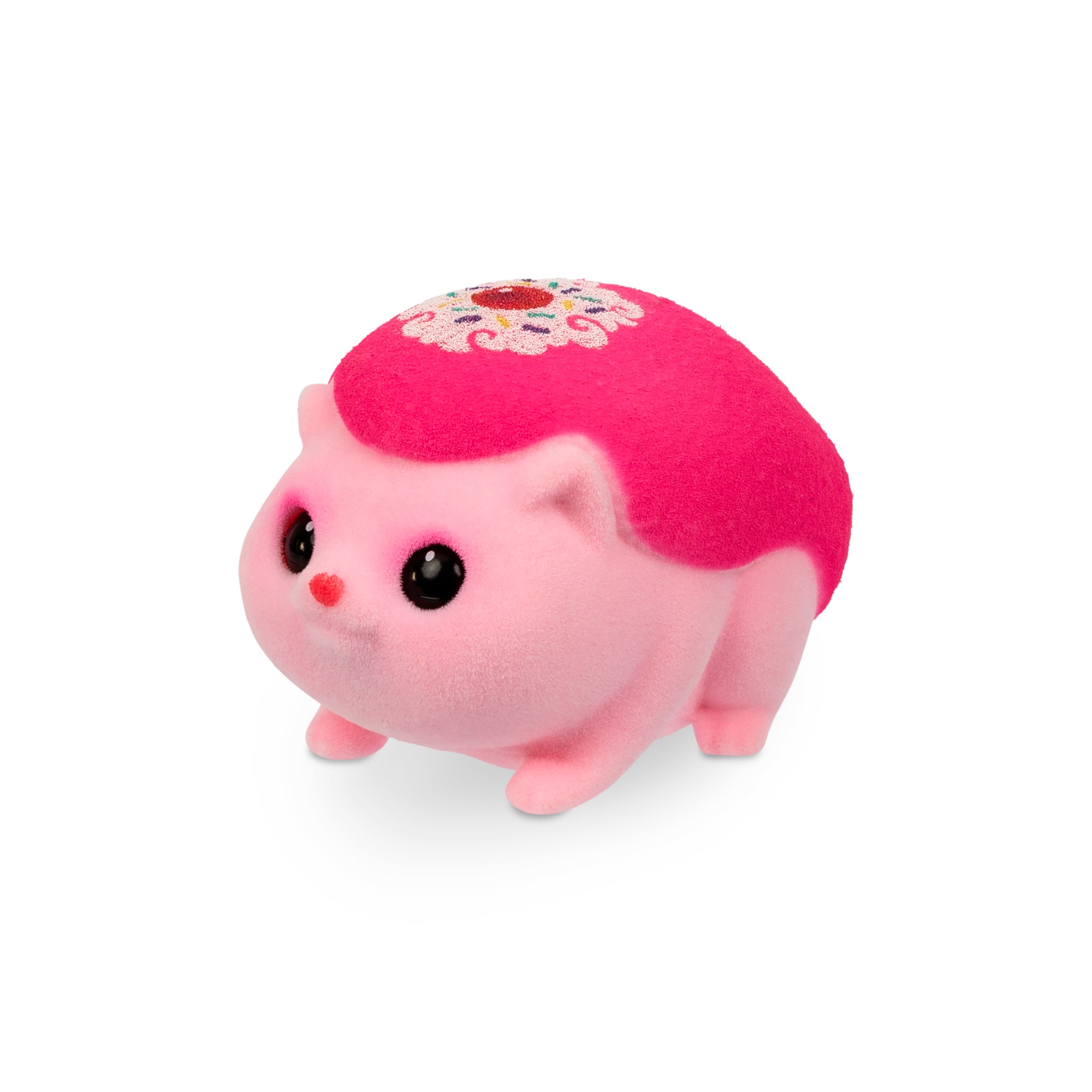 The Little Live Pets Needees Single Pack features a small, plush pink toy animal with big black eyes, a red nose, and a decorative pattern—perfect for fans of collectible characters.