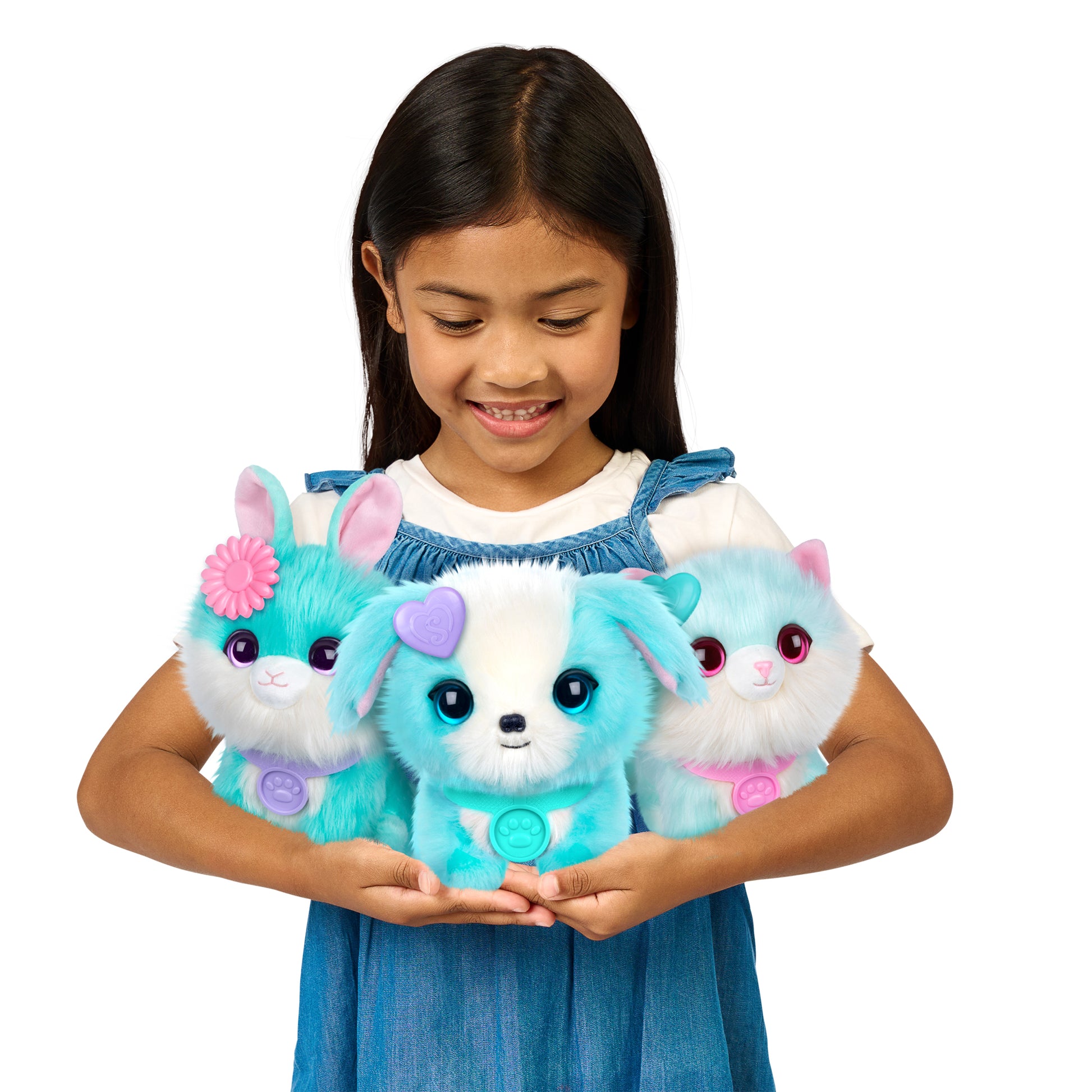 A smiling girl in a blue dress holds three Scruff A Luvs Single Pet Assortment plushies from Moose Toys—a bunny, puppy, and kitten with blue and white fur, pastel details, big eyes, and friendly expressions perfect for cuddles.