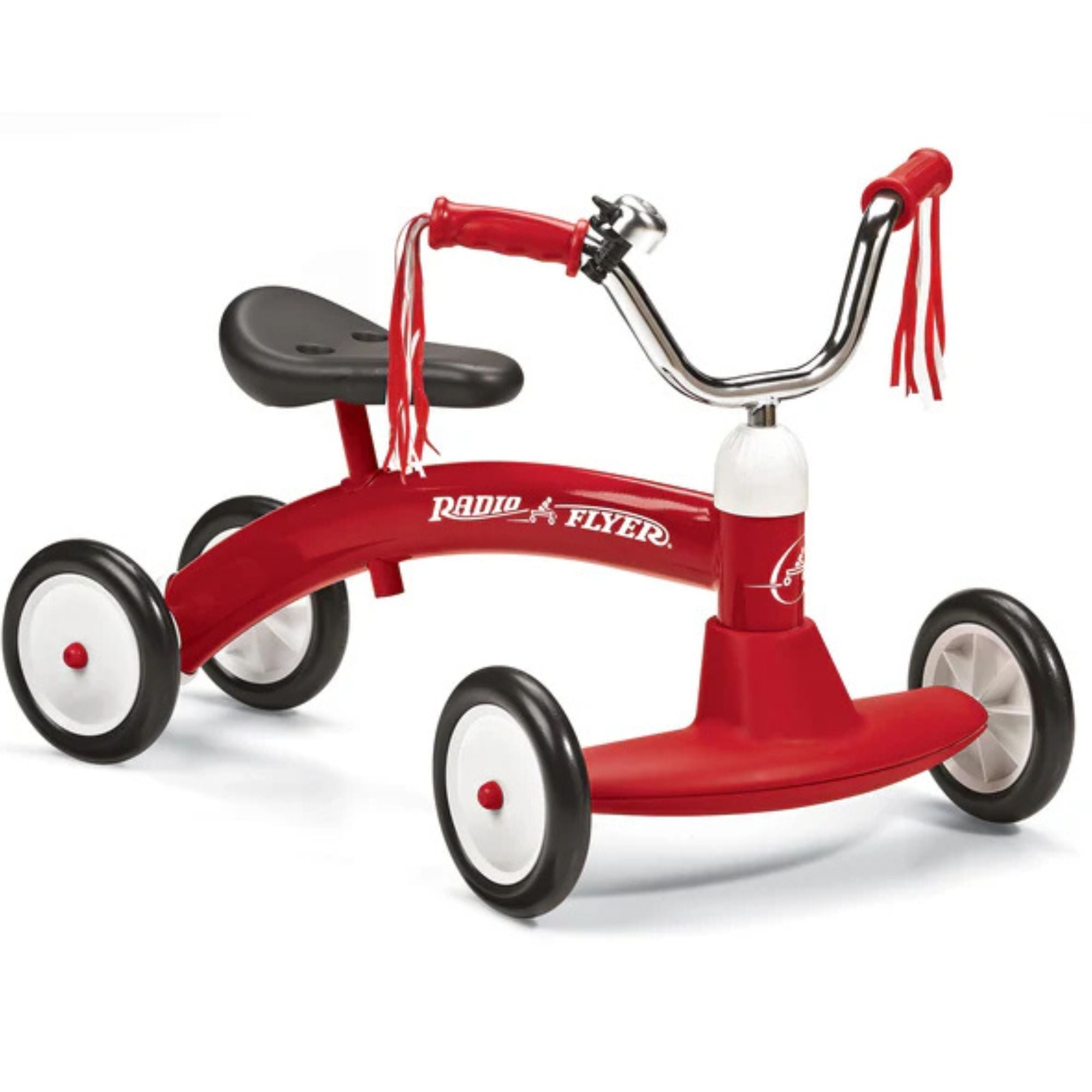 The Radio Flyer Scoot About is a red toddler ride-on with a black seat, handlebars featuring red and white streamers, and four black wheels. Its curved frame sits low to the ground, making it a classic toy for little ones.