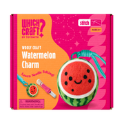 The Which Craft Watermelon Wooly Charm kit by Which Craft features a smiling watermelon charm, felting tool, and keychain—a fun beginner craft for ages 8+, shown on a pink and orange background.