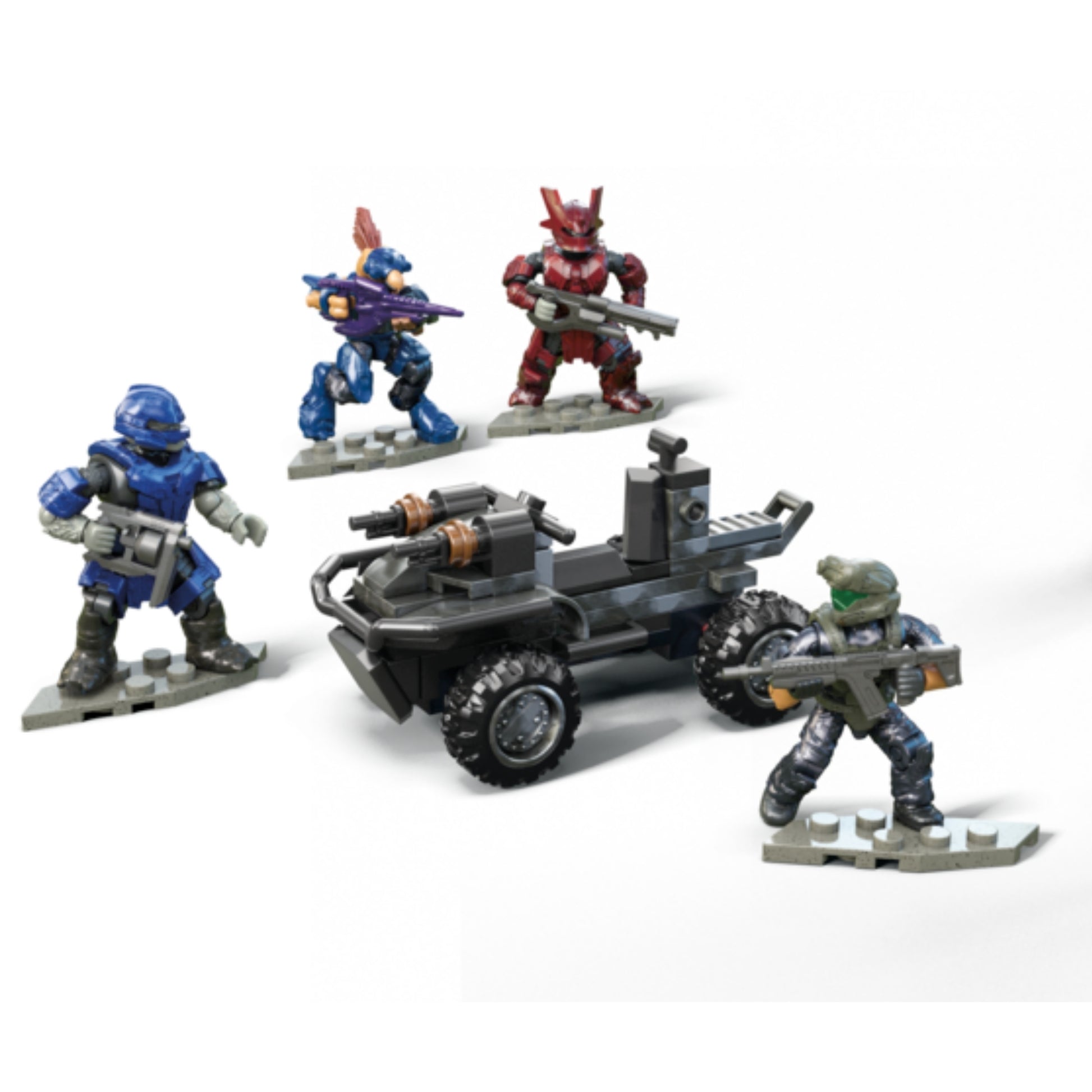 Four armored Mega Blocks Halo figures in blue, red, purple, and green, each with weapons, surround a small gray vehicle with a mounted gun from the Mega Blocks Small Vehicles Collection, posed for battle.