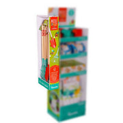 The Beetle & Bee Garden Tools Power Panel by Beetle & Bee Garden features three child-sized wooden-handled tools with green metal ends, reflecting sustainability, displayed on a retail shelf with colorful products in the background.