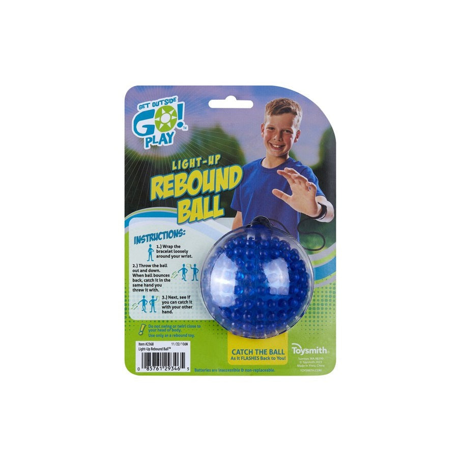 A blue GO! Light-Up Rebound Ball in packaging with a smiling boy in a blue shirt. The package reads “GO! Play Light-Up Rebound Ball,” includes instructions, and is branded by GO! Play—a glowing toy for outdoor fun.
